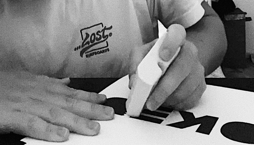 Incorporating actual surf wax into the logo