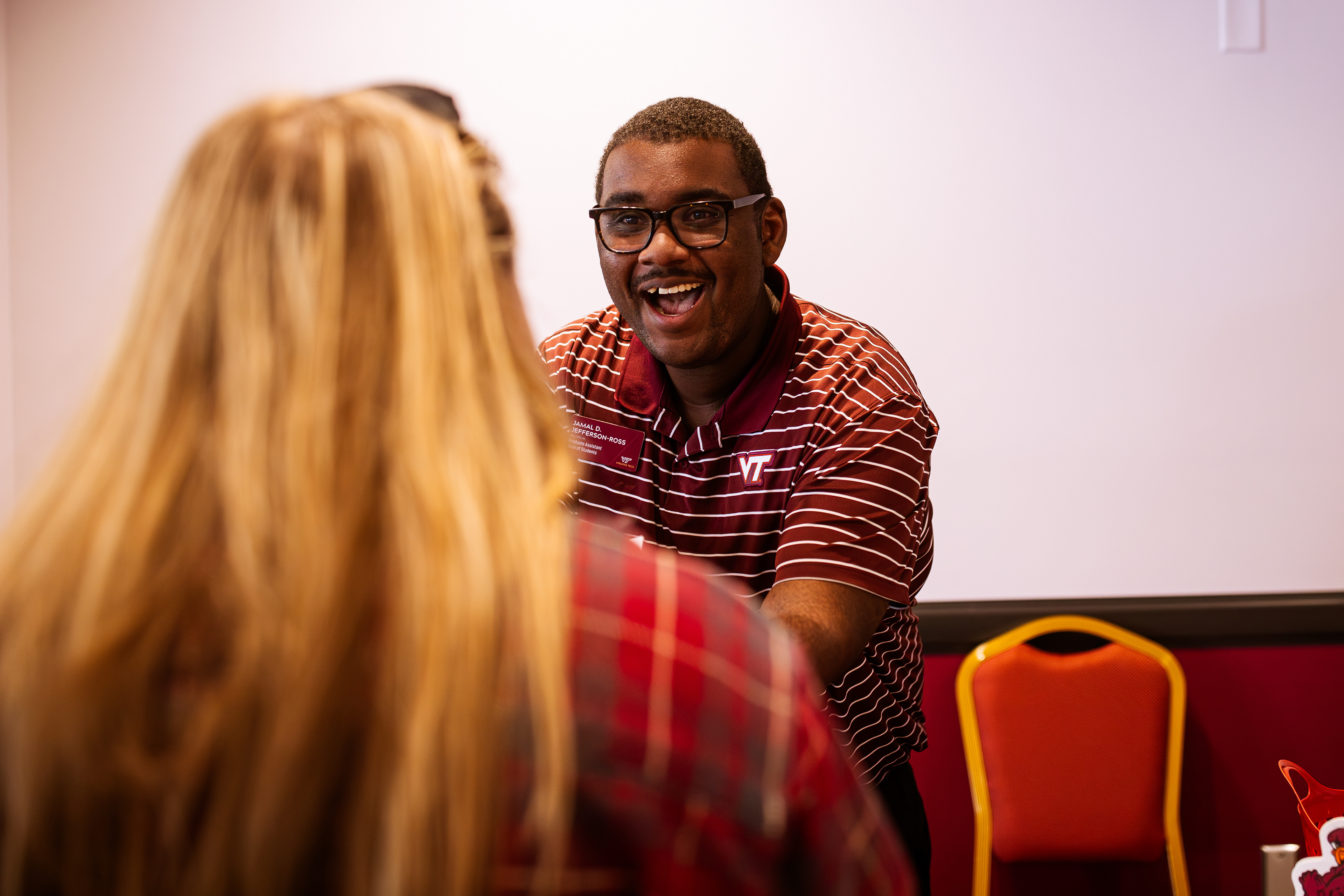GenerationOne program mentor Jamal Jefferson-Ross welcomes his first booth visitor of the day on Monday, Oct. 14, 2024. (Thomas Bray/JMC 4114)