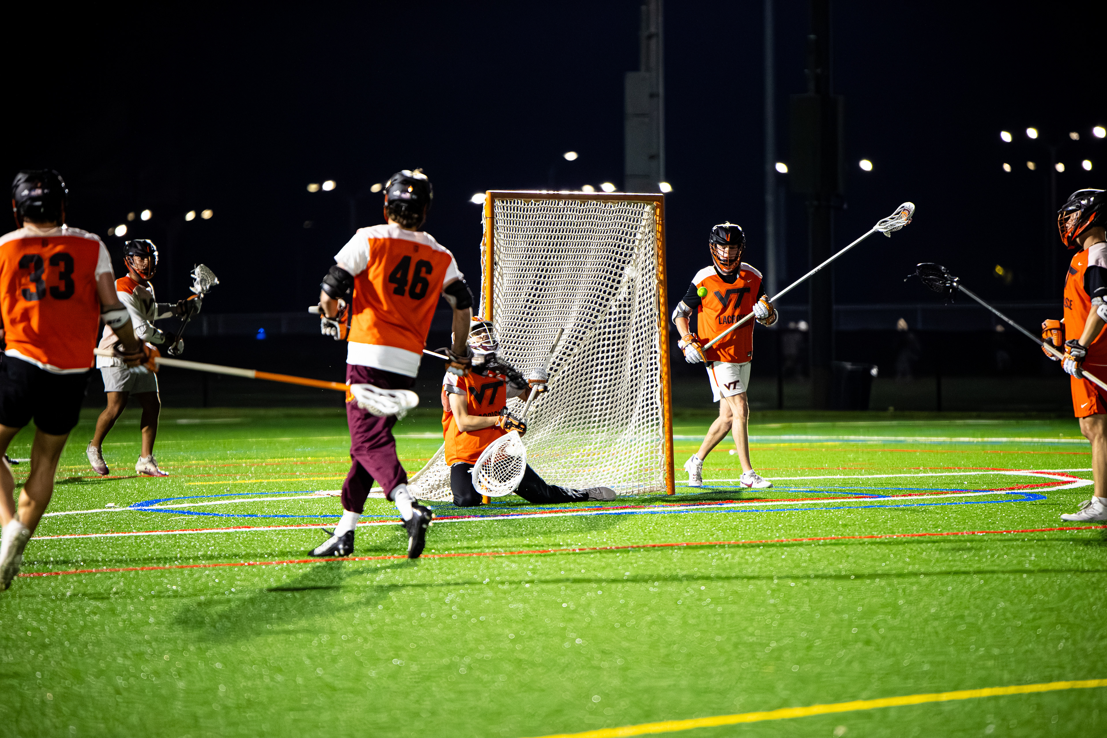 Andrew Wickman (15) secures a save after a defensive error by Patrick Joney (24) on Oct. 29, 2024. (Thomas Bray/JMC 4114)