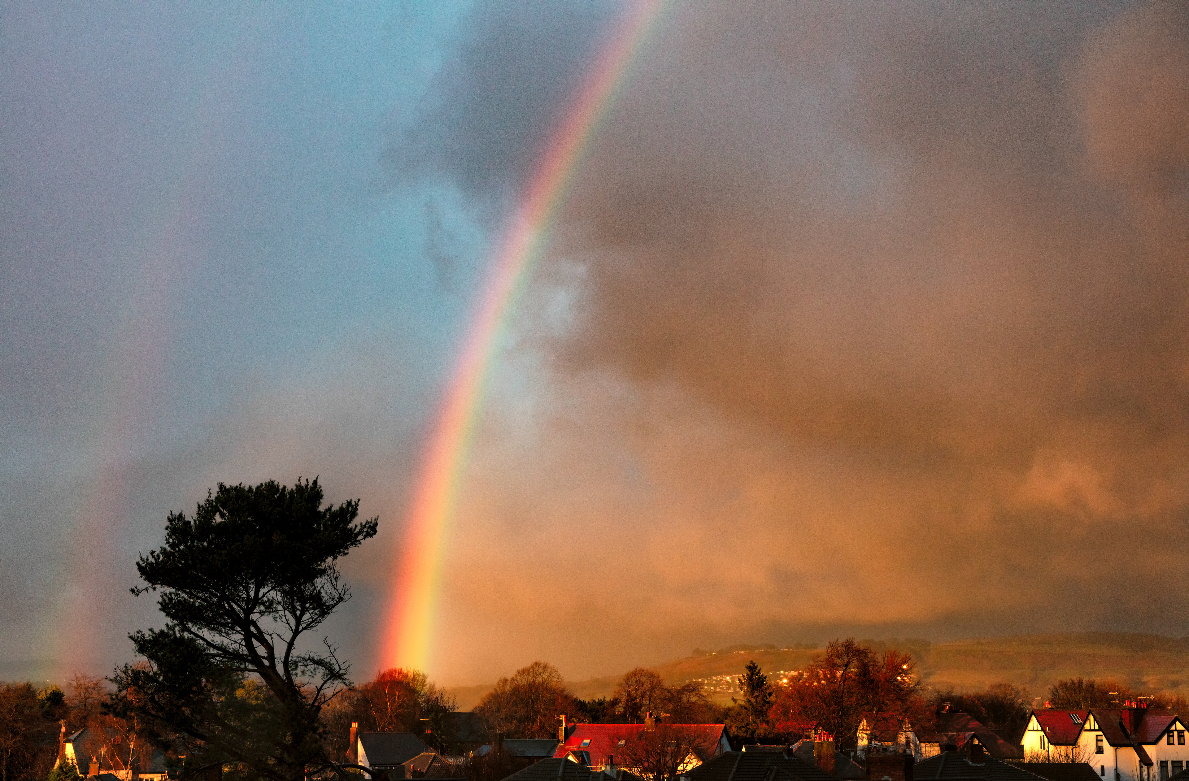 Magnicient rainbow and colourful clouds over Baildon Moor in Airedale