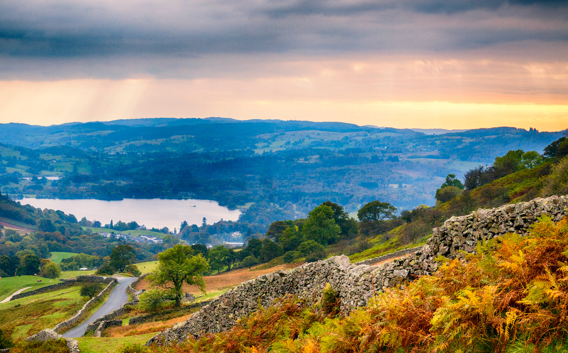 Dark clouds gather over Windermere in the English Lake District. Viewed from the top of the Struggle, Kirkstone Pass.