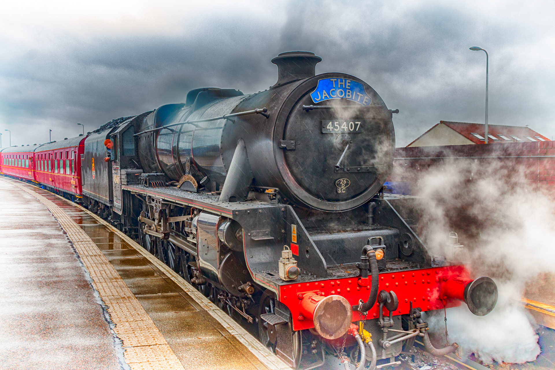 Black 5 45407 arrives at Mallaig with The Jacobite on a very wet day