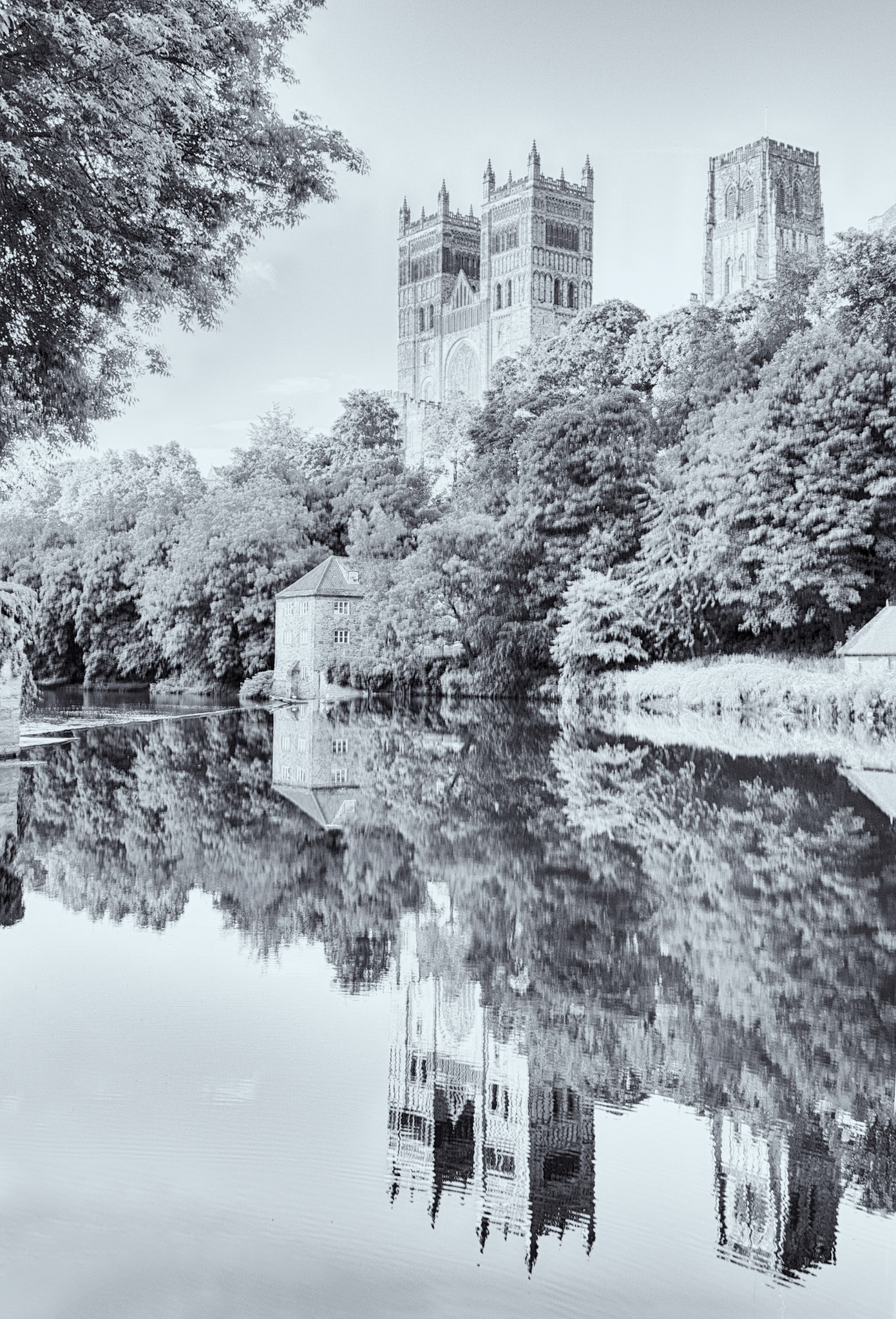 A toned image of Durham Cathedral and Mill on a still quiet summer morning offering a great reflection in the slow moving River Wear.