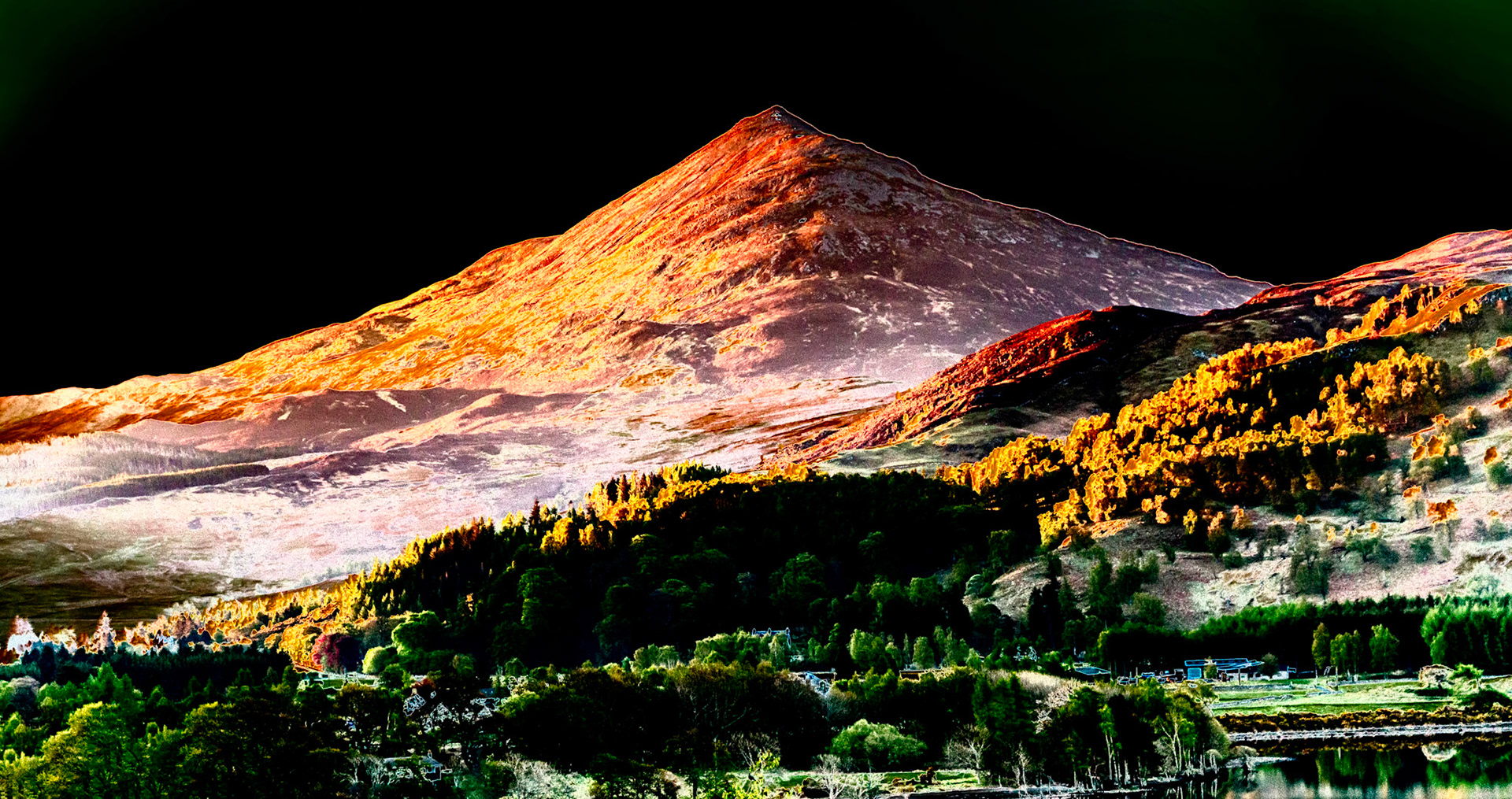 Early morning sunlight creeps across Schiehallion in Perthshire, Scotland. This beauriful mountain is a beacon in the Loch Rannoch area with its stereotypical shape and uncluttered background.