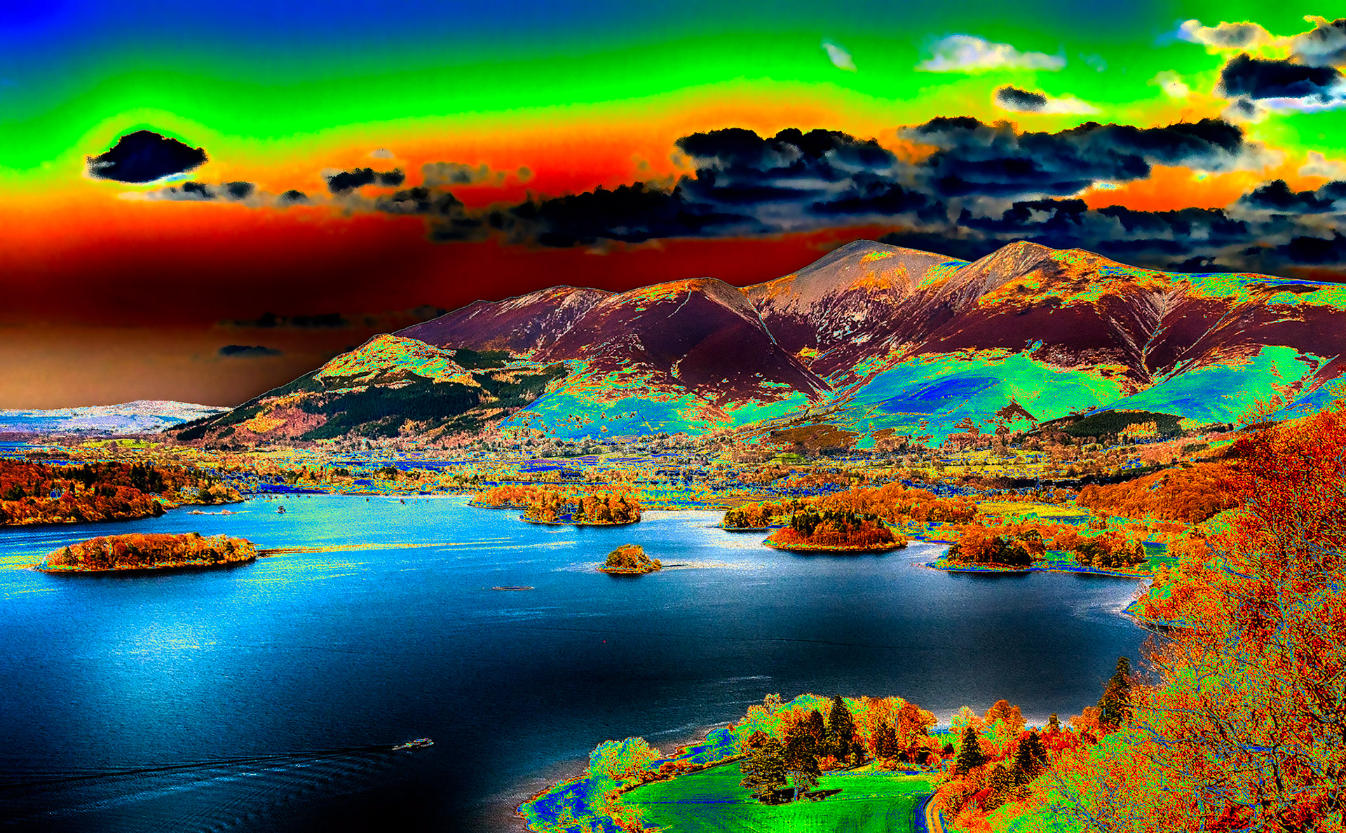 The mountain of Skiddaw rise majesticly behind the town of Keswick and the Derwentwater lake in the english Lake District national park. A dramatic solarisation effect applied to this image showing the light in a whole new spectrum.