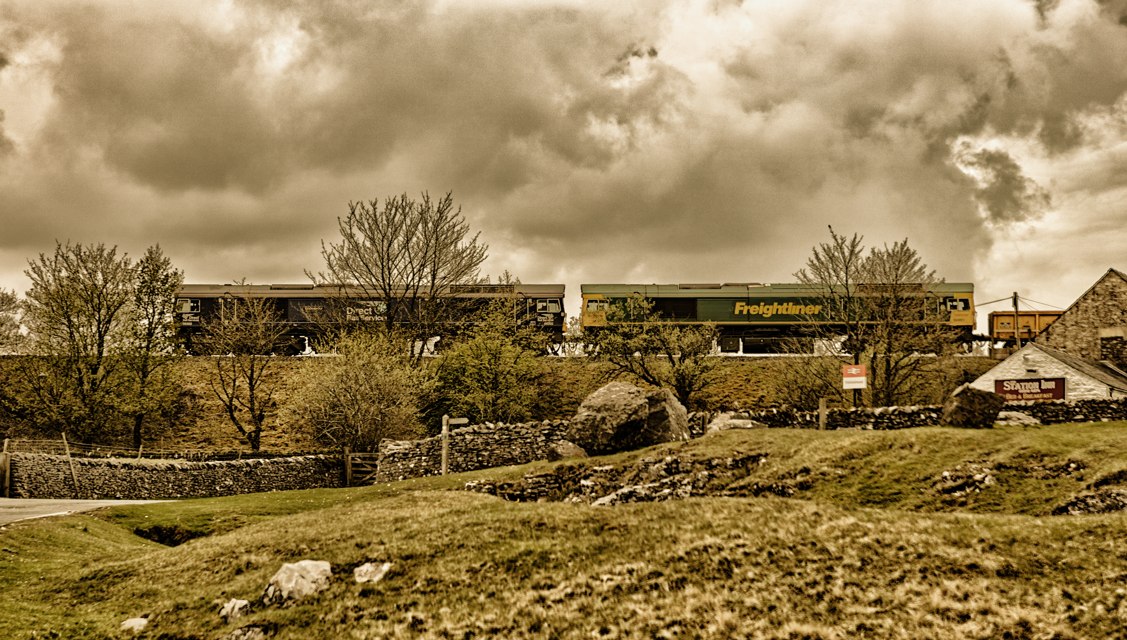 Toned image - Double head Class 66's pass Ribblehead