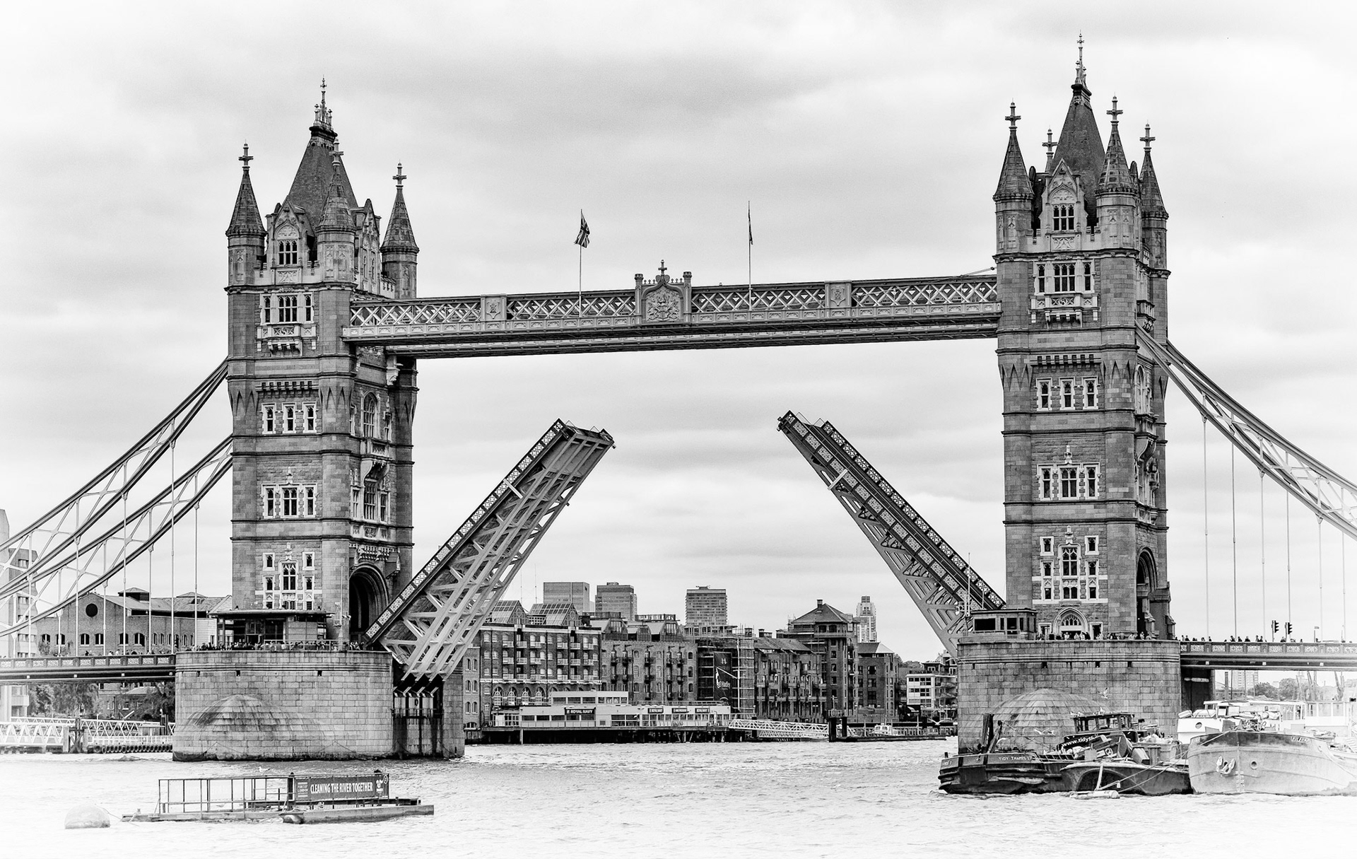 A toned image of London's iconic 19th century-built Tower Bridge. The outer brick cladding was changed to harmonise with the nearby Tower of London by George D Stevenson who took over the project after the death of architect Sir Horace Jones. Construction began in 1886 and it was opened by the Prince of Wales, later King Edward VII, in 1894.