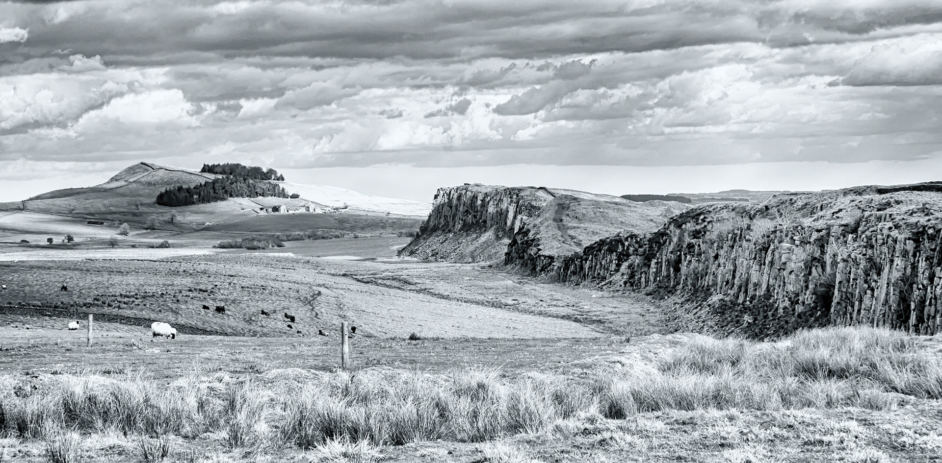 A toned image portraying the natural defensive barrier of Steel Rigg on which the Roman Empire's Hadrian's Wall was built in Northumberland, England. 