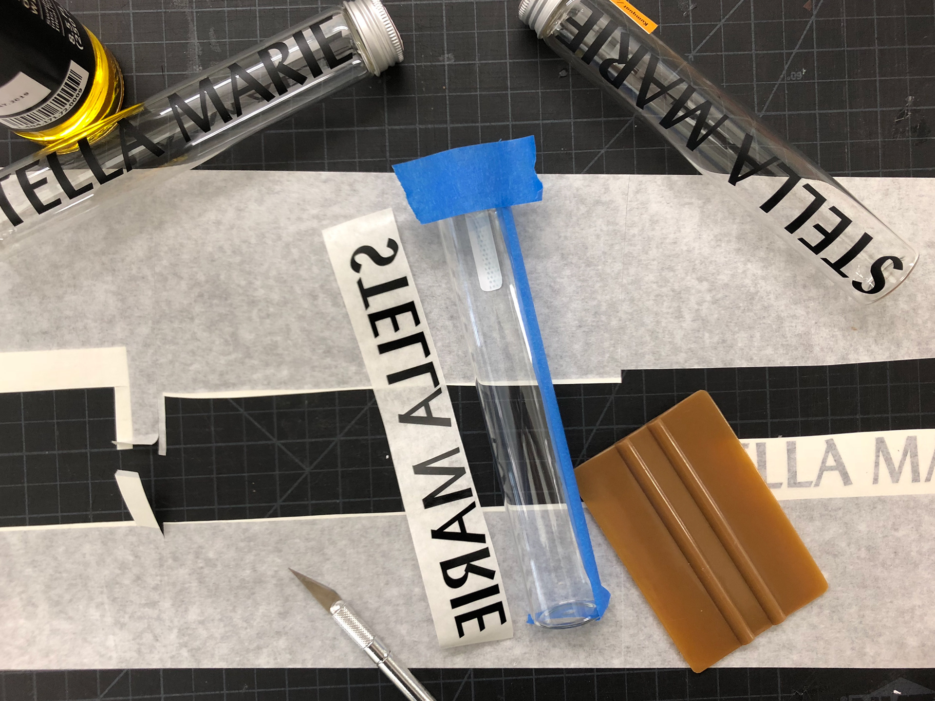 Applying vinyl logo on form.