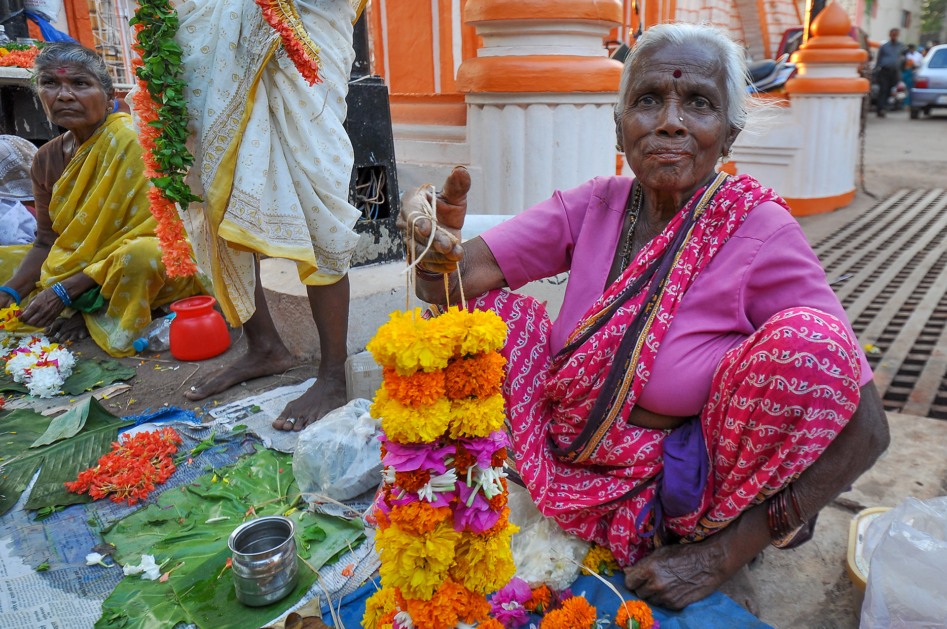 Mangeshi Temple (450-year-old Hindu Temple), one of the largest and most frequently visited temples in Goa, India. Every Monday, the idol of Manguesh is taken out for a procession accompanied by music. In the afternoon the lord dons a dress and is decorated with fragrant flowers invoking obeisance and forgiveness before the Almighty. Outside the temple, tourists get the chance as well to buy these flowers.