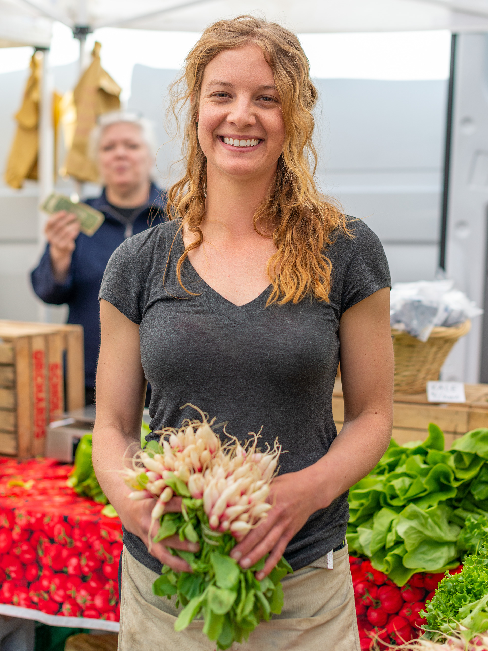 While in New York, make sure to visit Union Square Greenmarket, a year-round large market with over 70 booths of farm produce, flowers, foods, and more. I wanted to do an environmental portraiture so I asked this beautiful radish seller to pose for me and she did with a gorgeous smile.