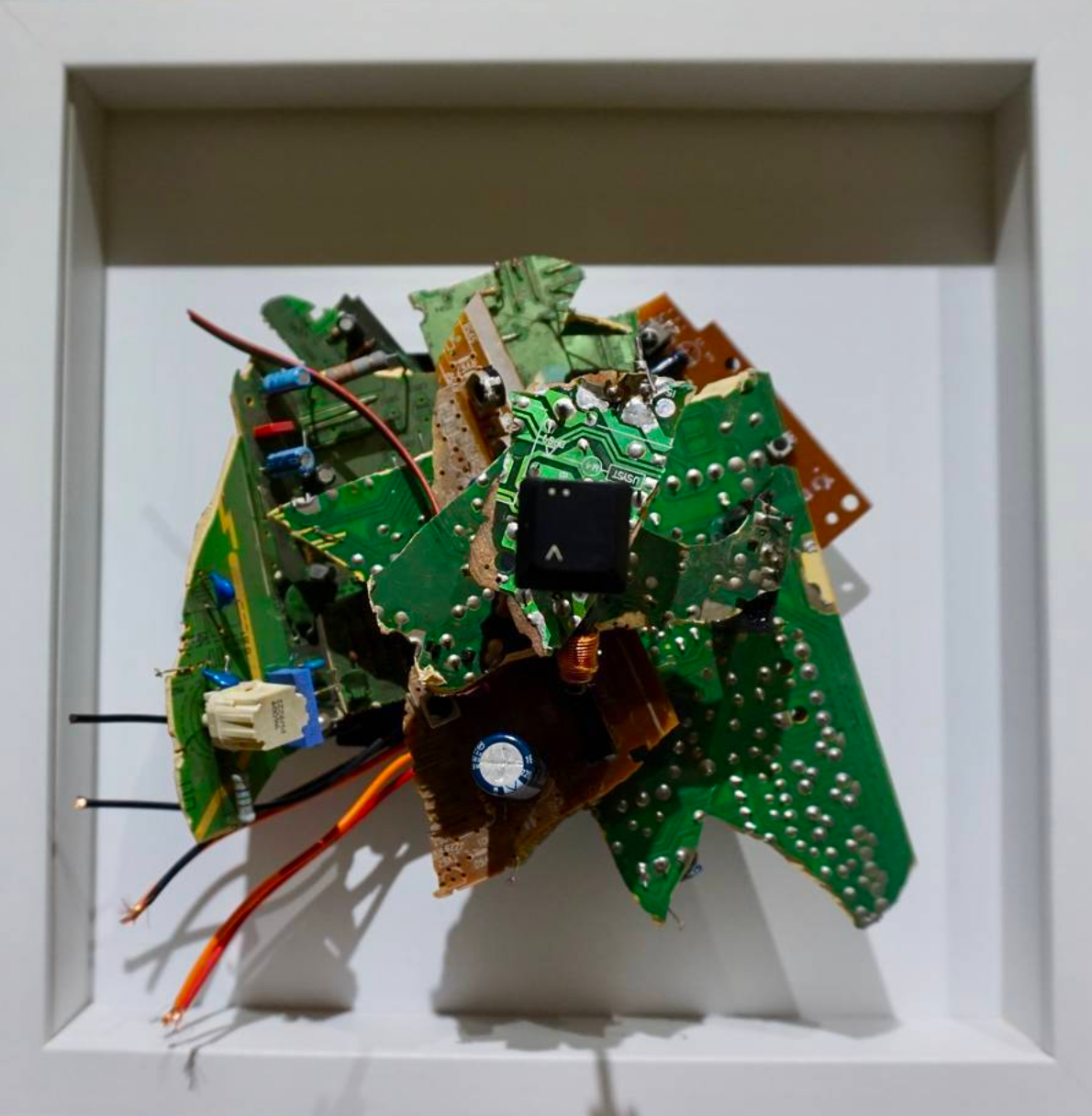 : < Electronic waste on metal base