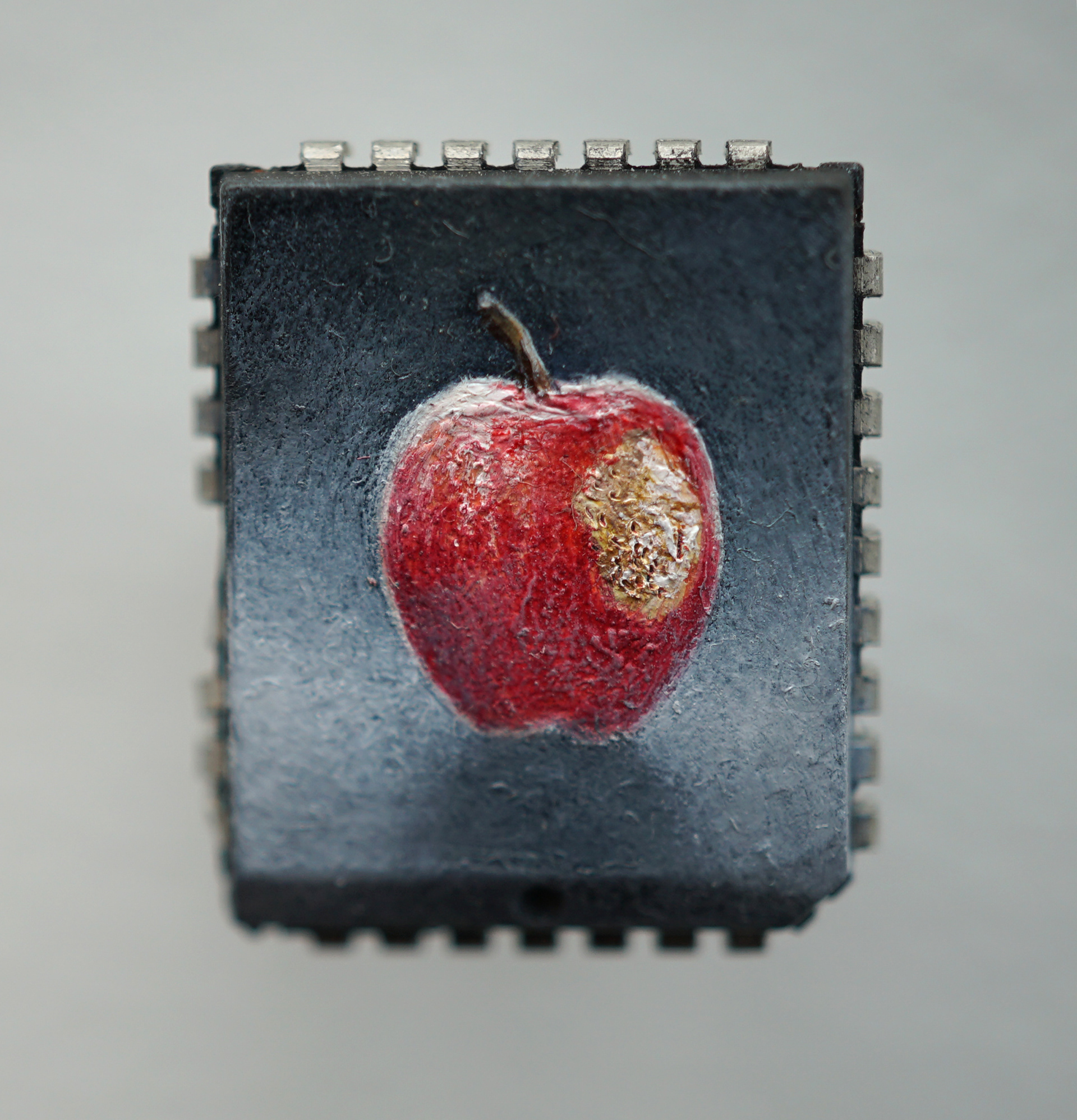 Apple (bitten), oil paint on microchip, 2026