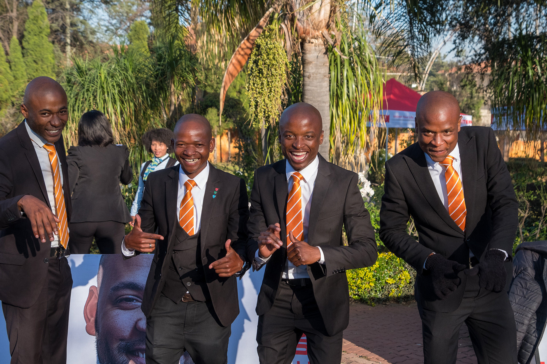 group of men in suits taken at a corporate event