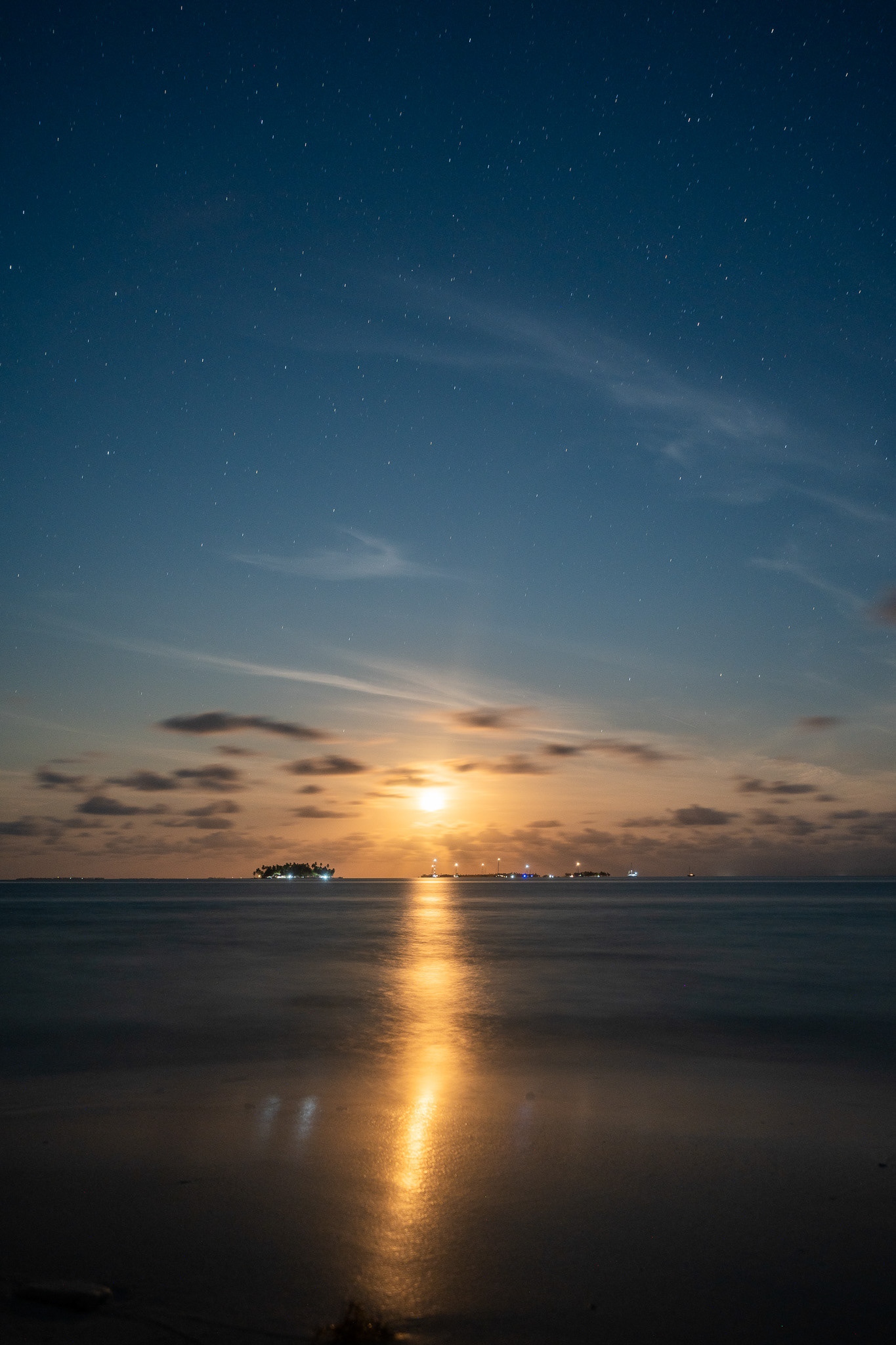 The rich, golden yellow moon rises over the San Blas islands