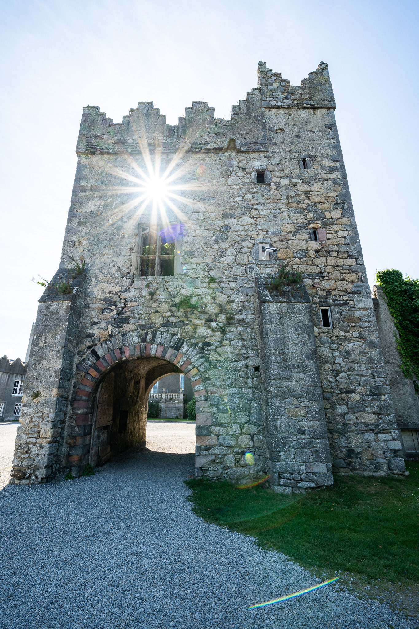 The sun peeks through an empty window at Howth Castle