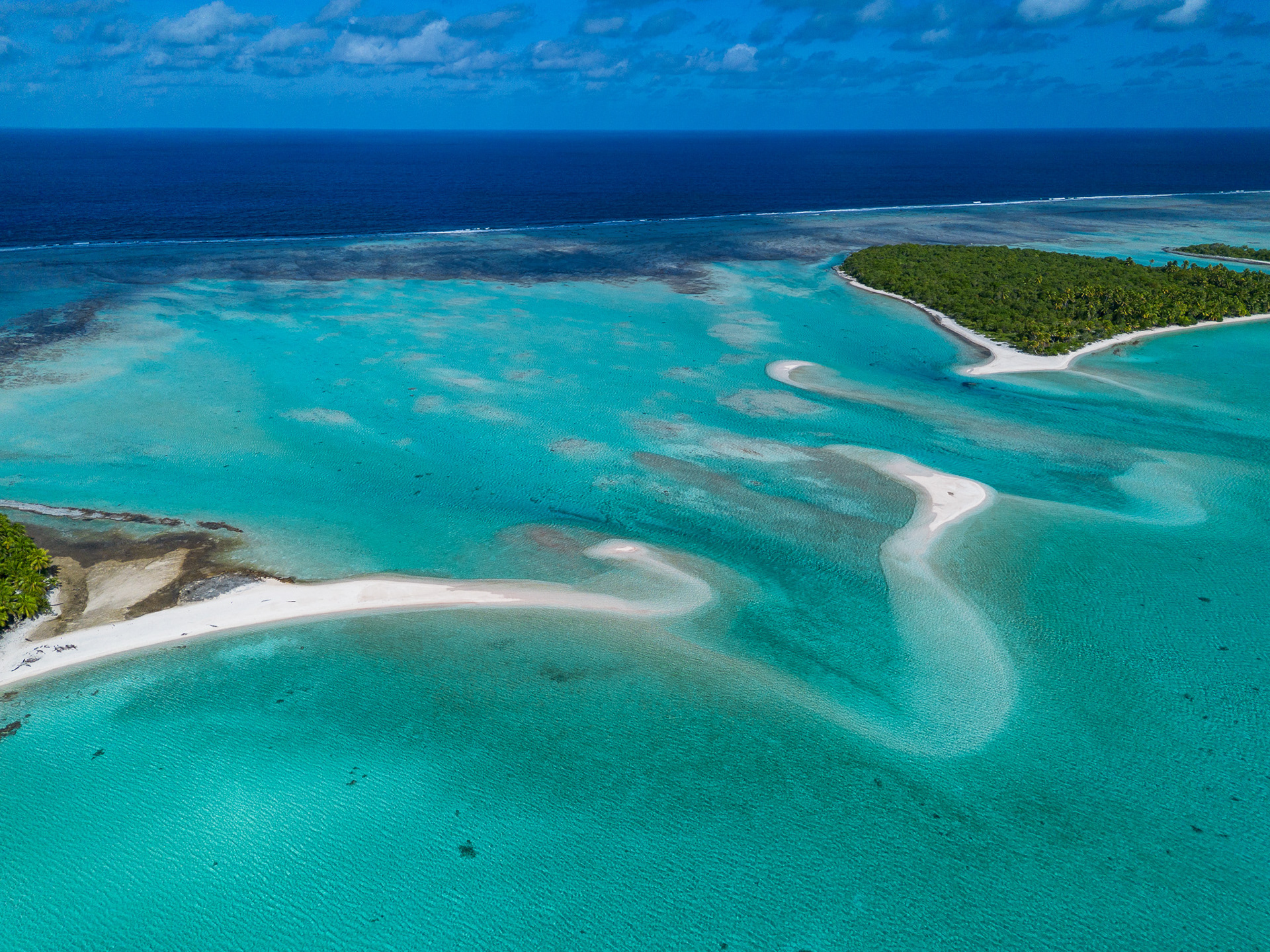 The barrier reef forming the atoll blocks the outside ocean