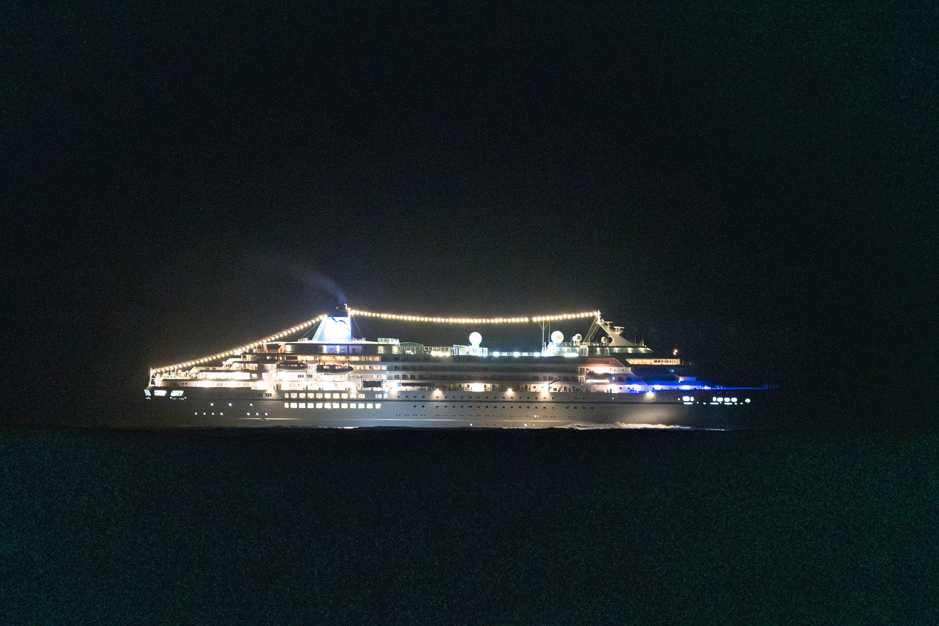 From over a mile away, cruise ship Amadea lit up Stardust to the point that I could see my own shadow