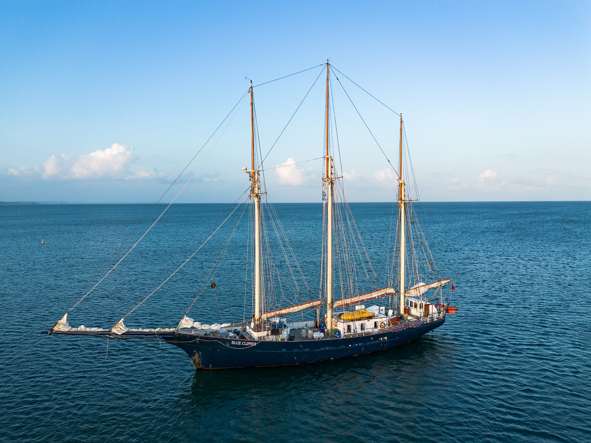 This gaff-rigged schooner anchored next to us in Porthallow right as the sun was setting, only to leave after dark to continue south