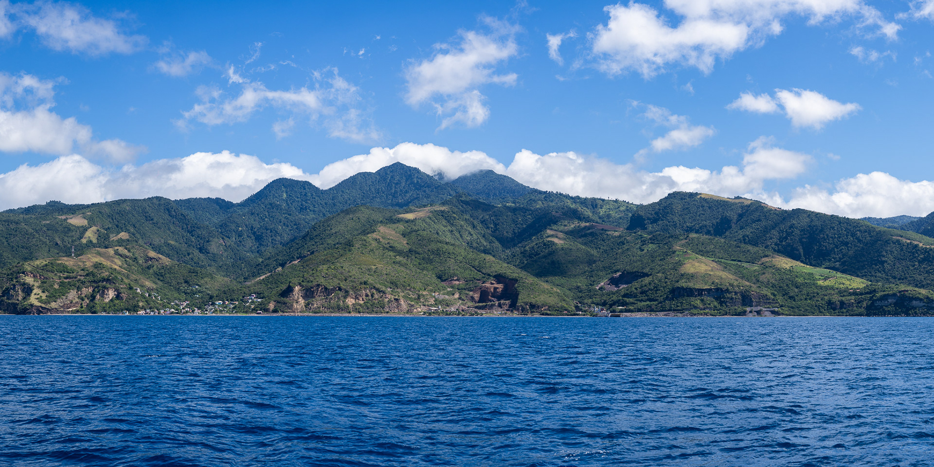 Cruising past Dominica's rolling mountains