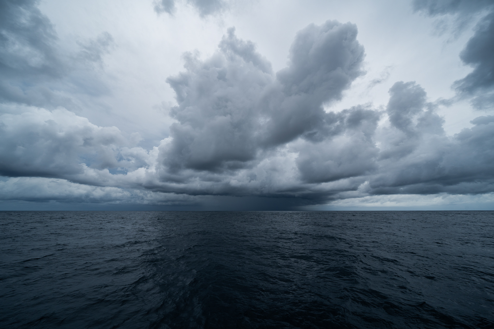 Dodging a dark squall, harboring wind and rain