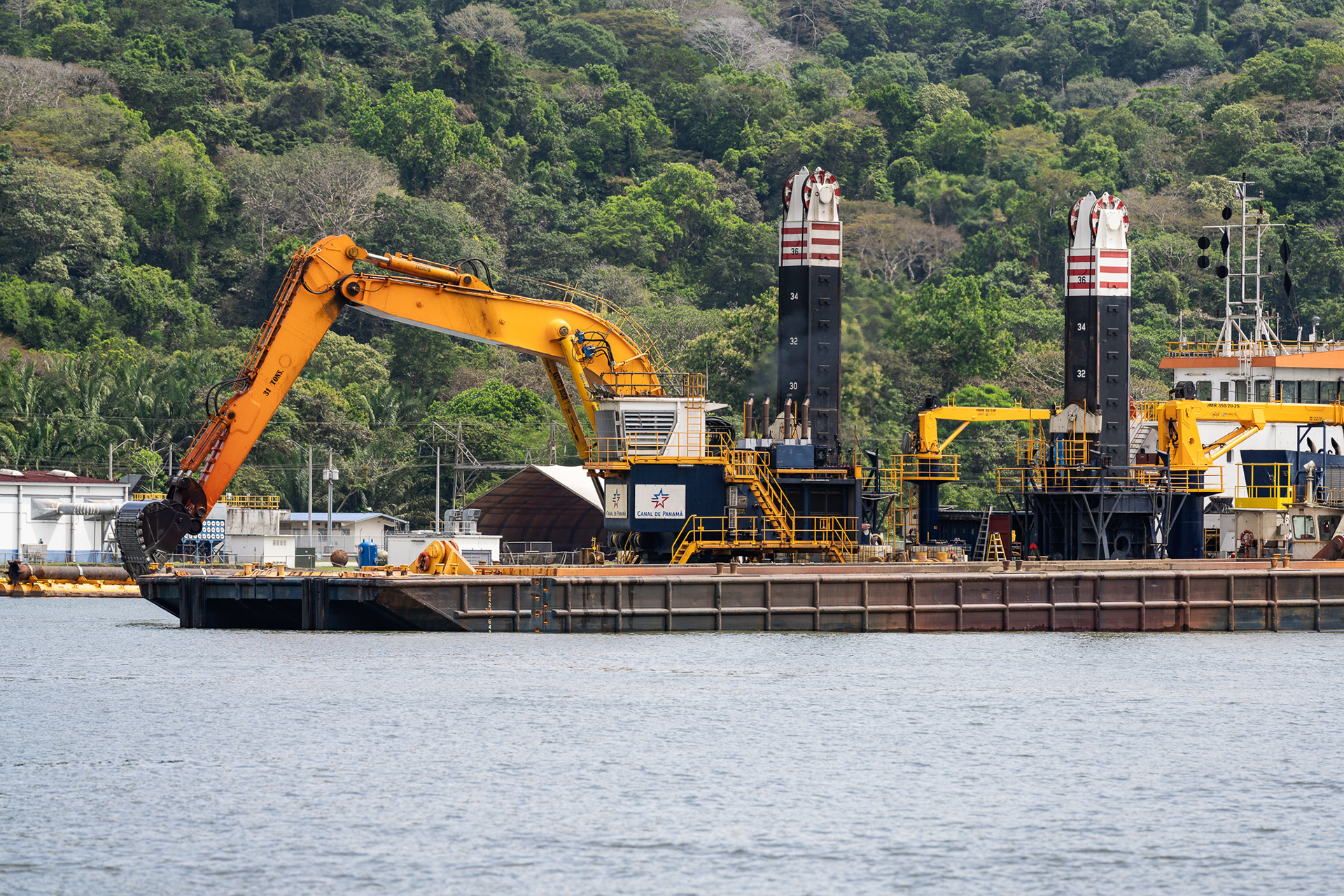 Given the large amount of vital traffic through the lake, regular upkeep of the channel is a must. Here, a dredging barge widens the channel by digging out earth