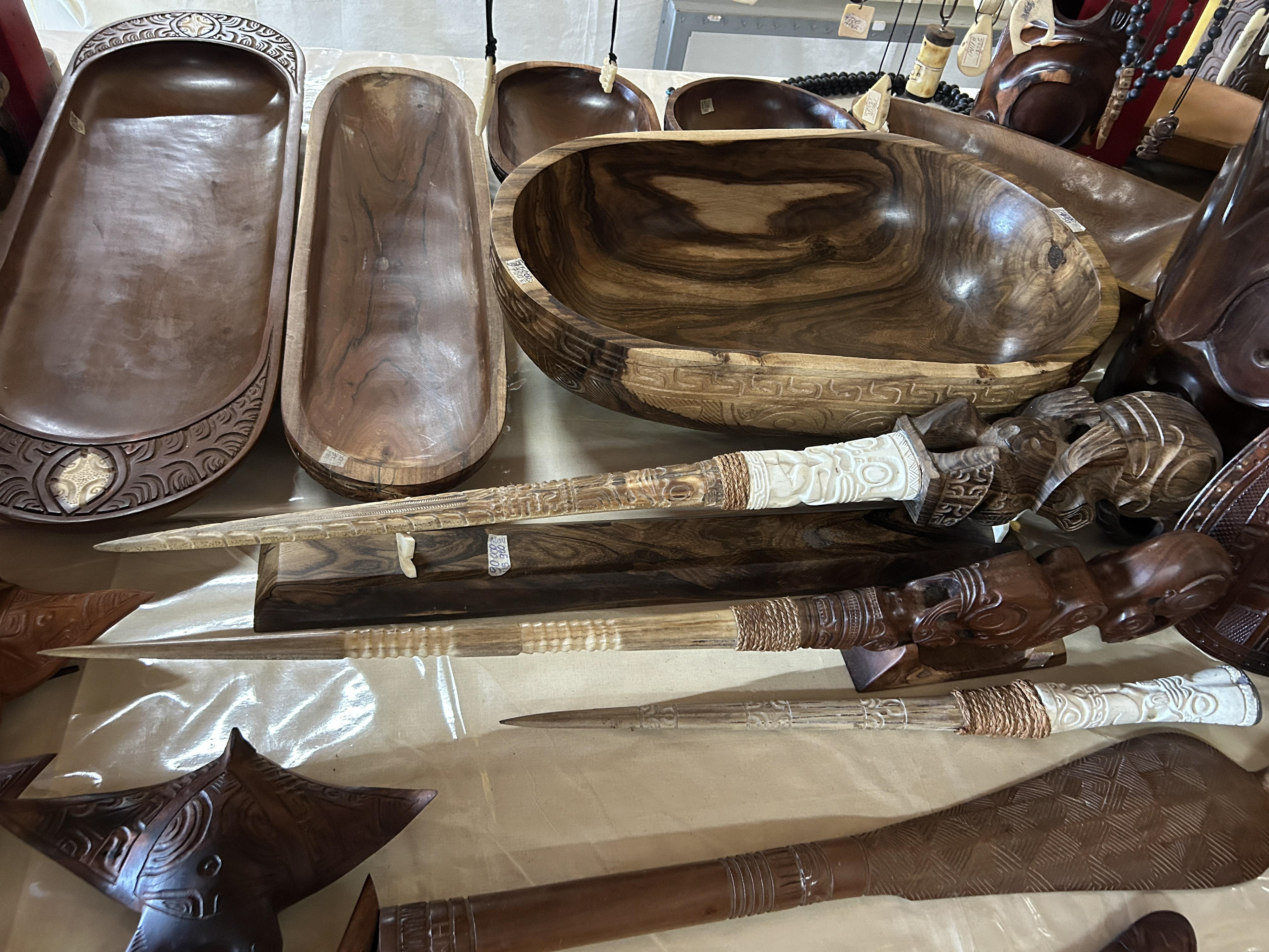 A variety of local carvings, including several marlin bills