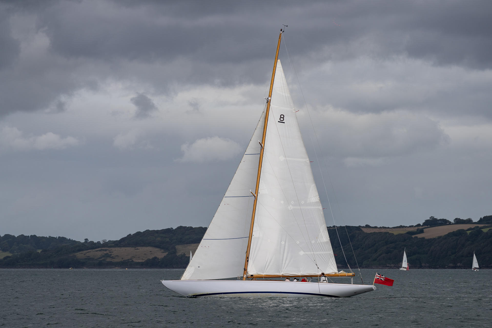 This sleek wooden boat cruises past us on our way into Falmouth