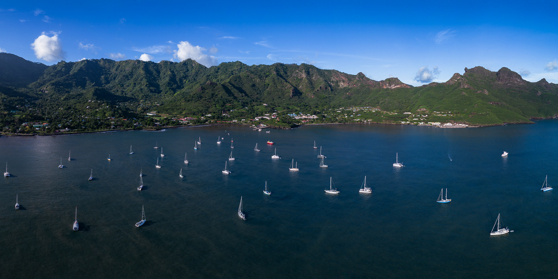 Veins of muddy water flow through the bay after several days of heavy rain wash down sediment from the mountains