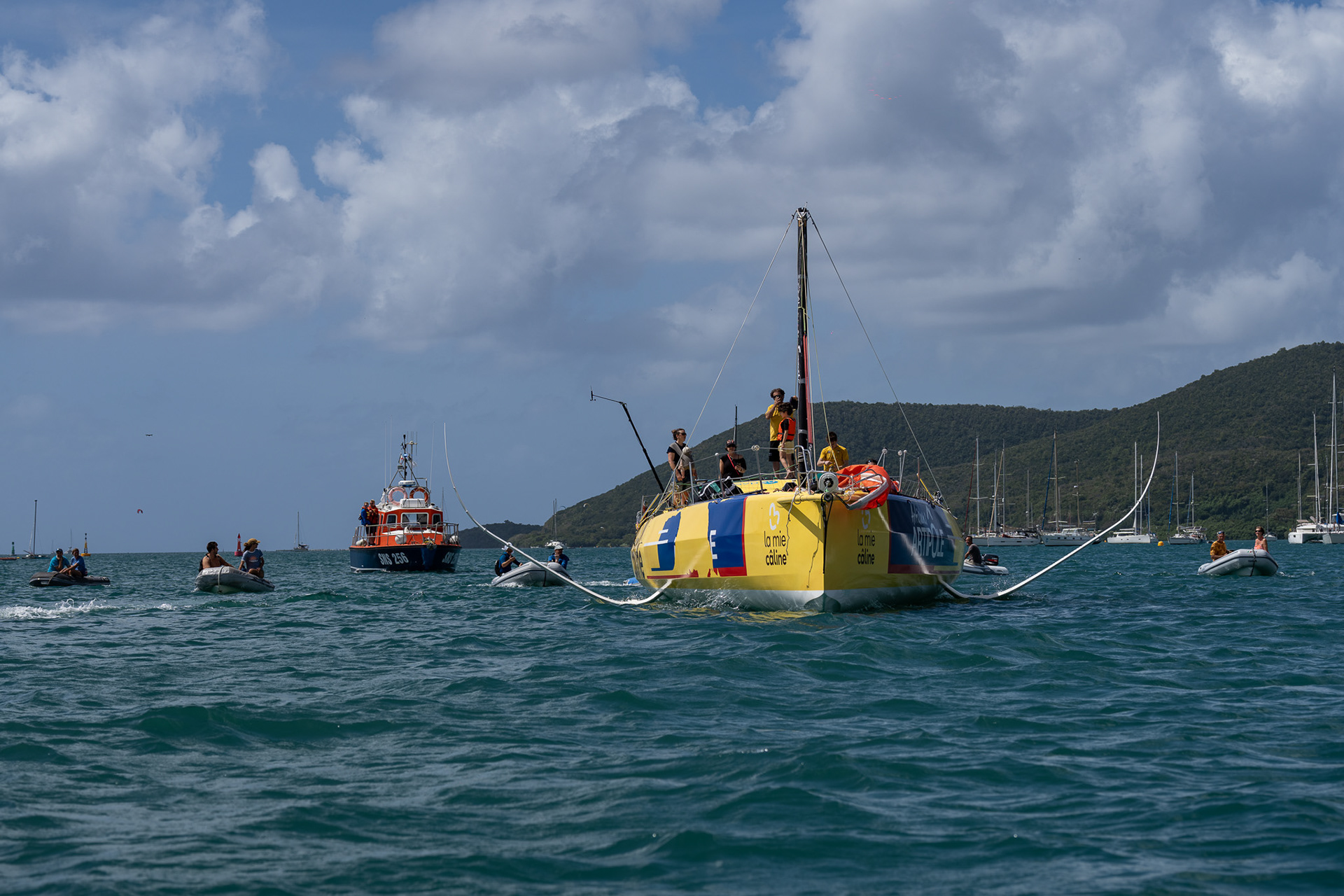Almost 20 dinghies accompanied the boat into the harbor and to the dock