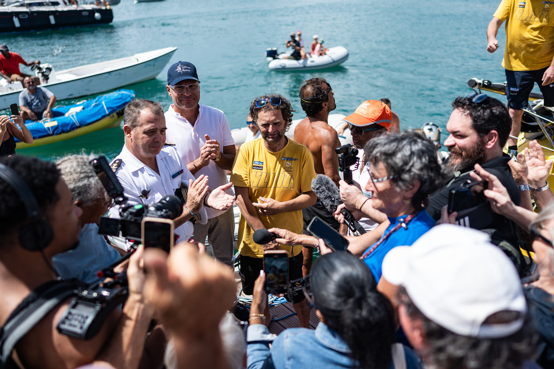 Members of the media crowd around Arnaud, anxious to hear his thoughts on the abandon of his fifth Vendee Globe