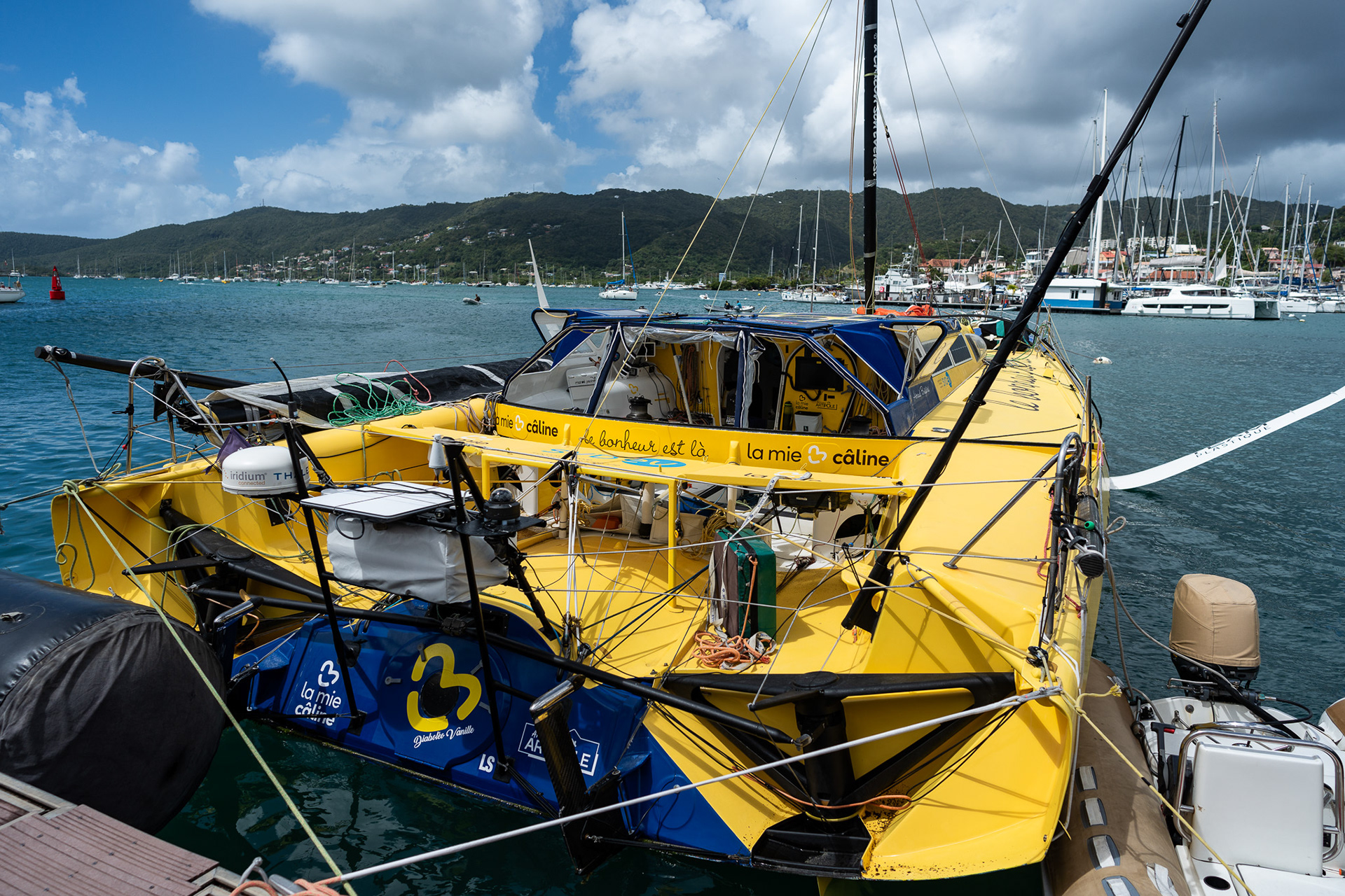 With no mast and only a jury rig, La Mie Caline rests at the dock for the first time in over 90 days