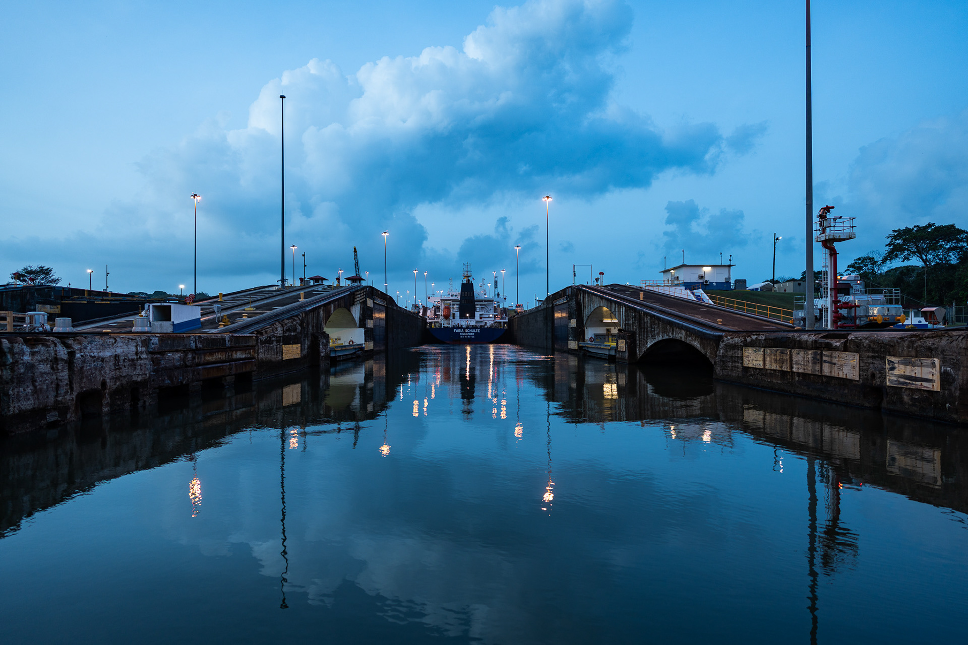 Day breaks as Stardust enters the first of three locks, going up to the level of Gatun Lake