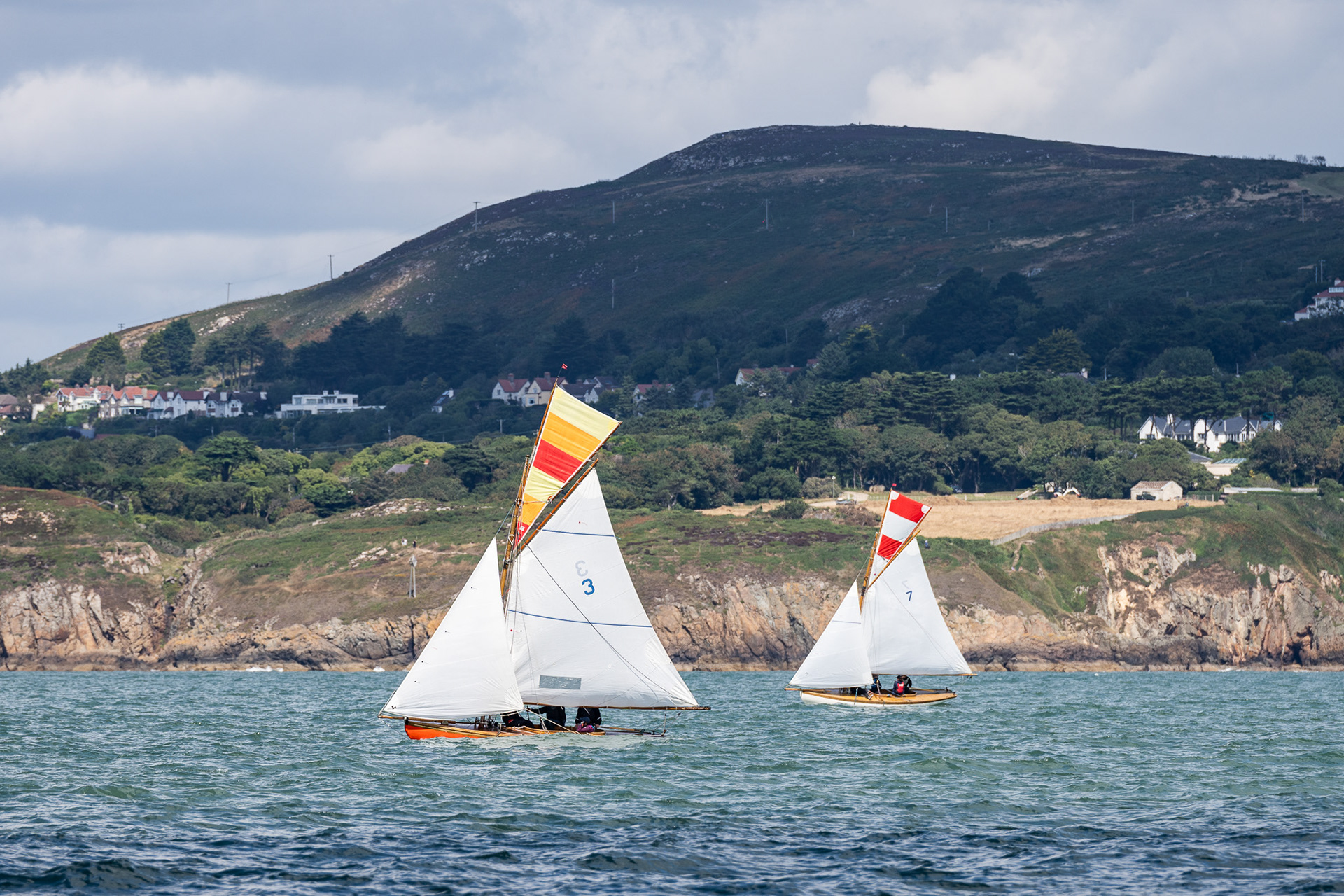 Two Howth 17s, the oldest one design class of racing yacht in the world. These traditional wooden boats were part of a larger fleet racing in Dublin Bay