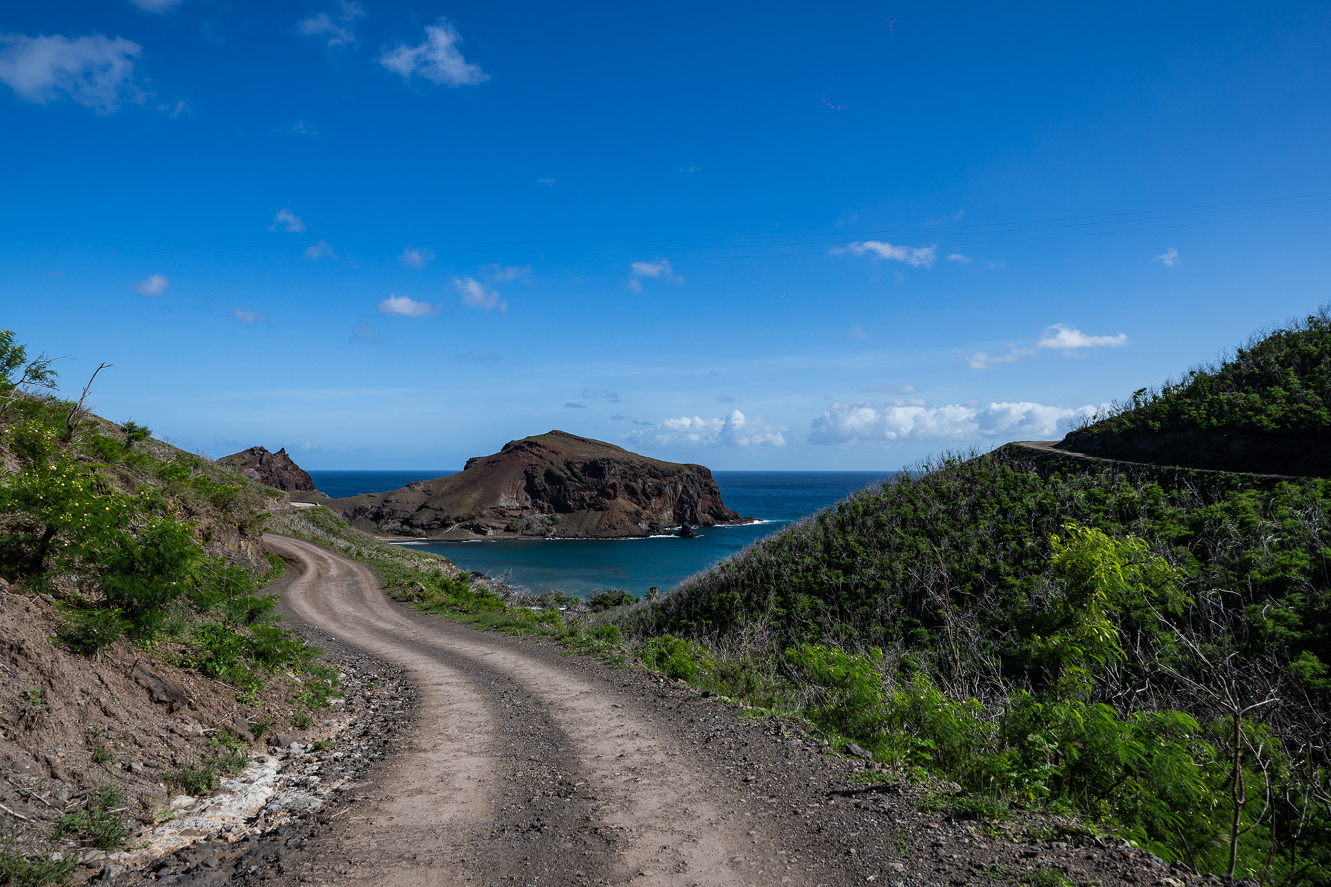 The only way around the circumference of Ua Pou is by a narrow dirt road