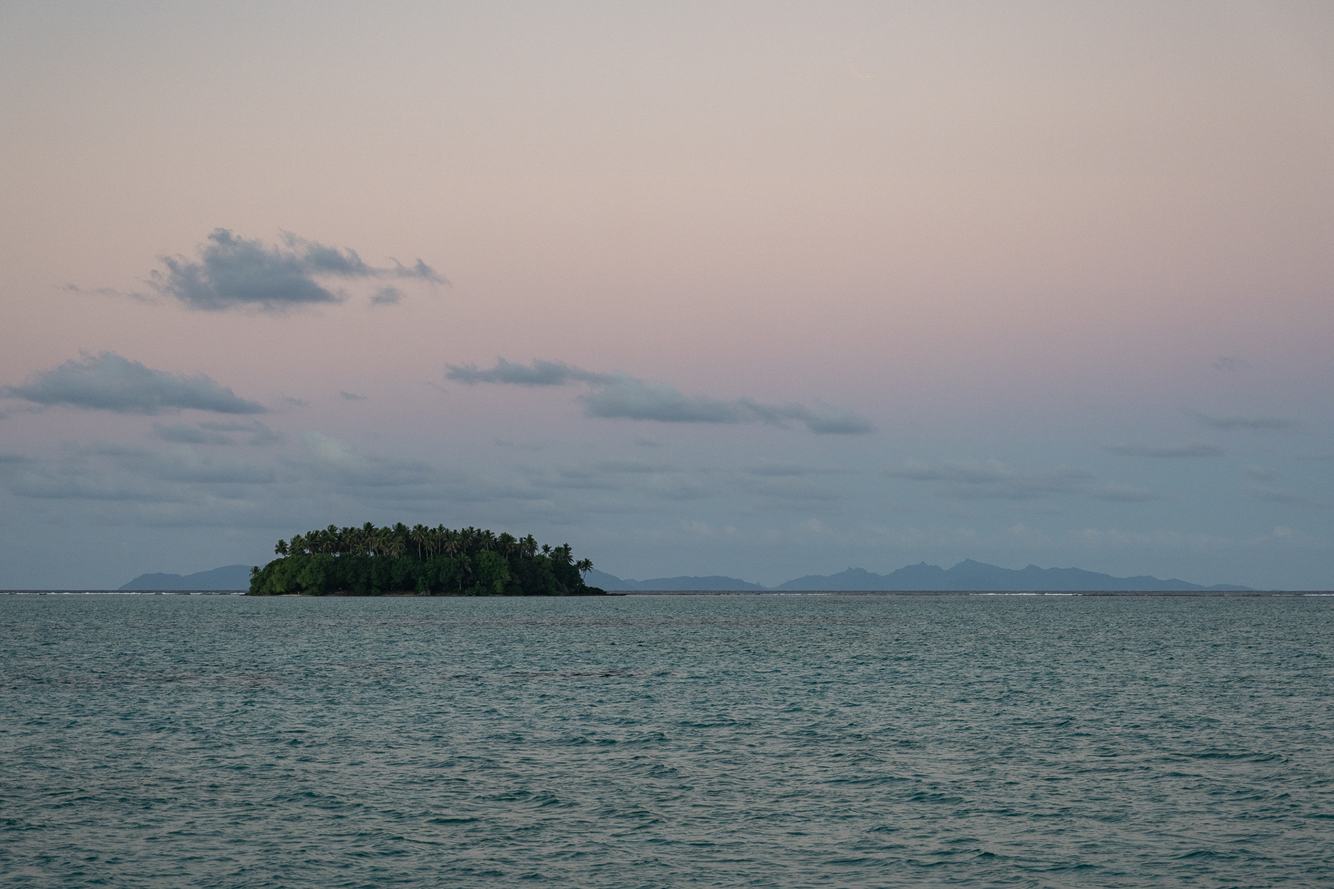 A motu sits between Stardust and Huahine to the east