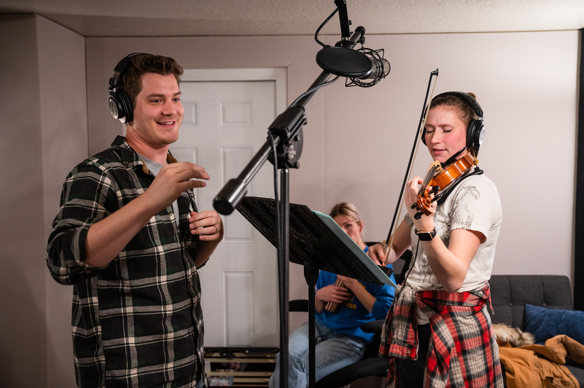 Landon, the album's producer, prepares to record Annie's violin tracks