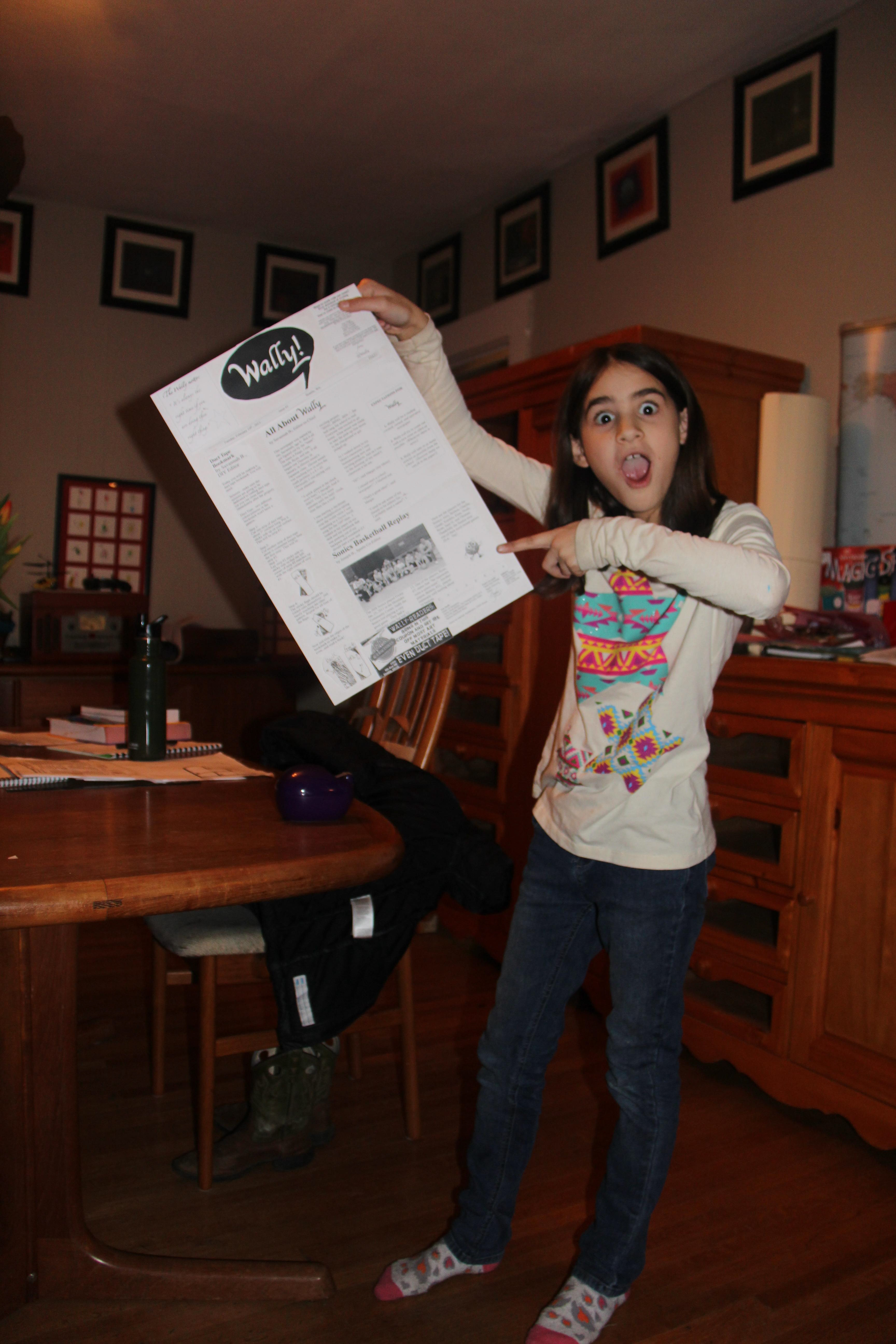 Savannah Butcher (age 9) posing next to her first issue of Wally.