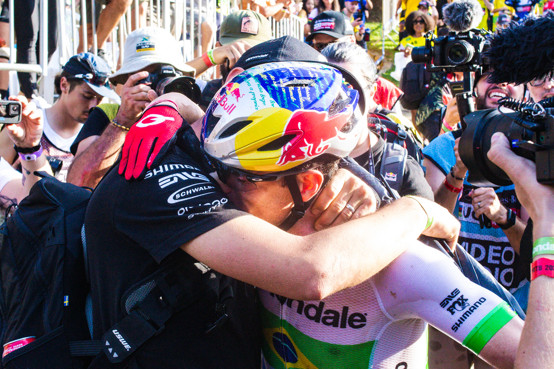 Henrique Avancini (Cannondale Factory Racing), emotional and crying, receives a hug from Manuel Fumic. The Brazilian was congratulated for his dedication to bringing the MTB World Cup to his native Brazil - Petrópolis, Brazil - April 10, 2022.