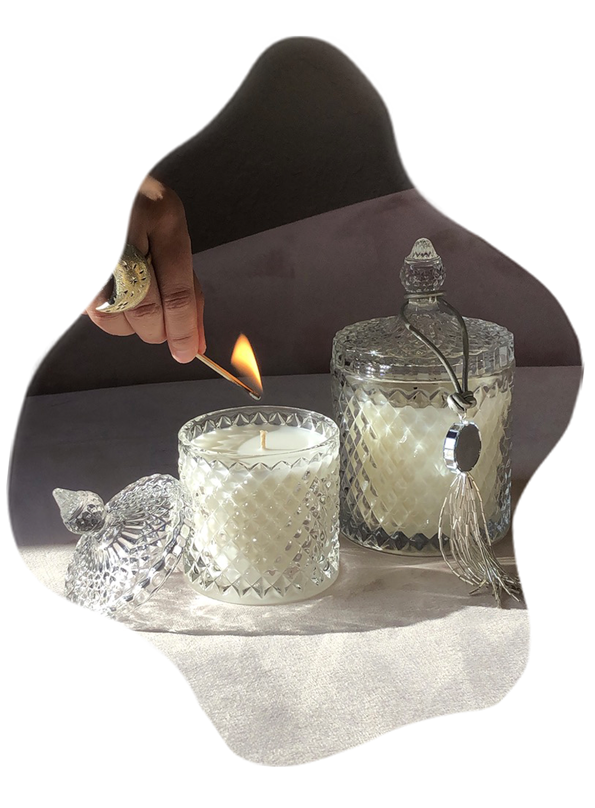 Hand with lit match, lighting candle