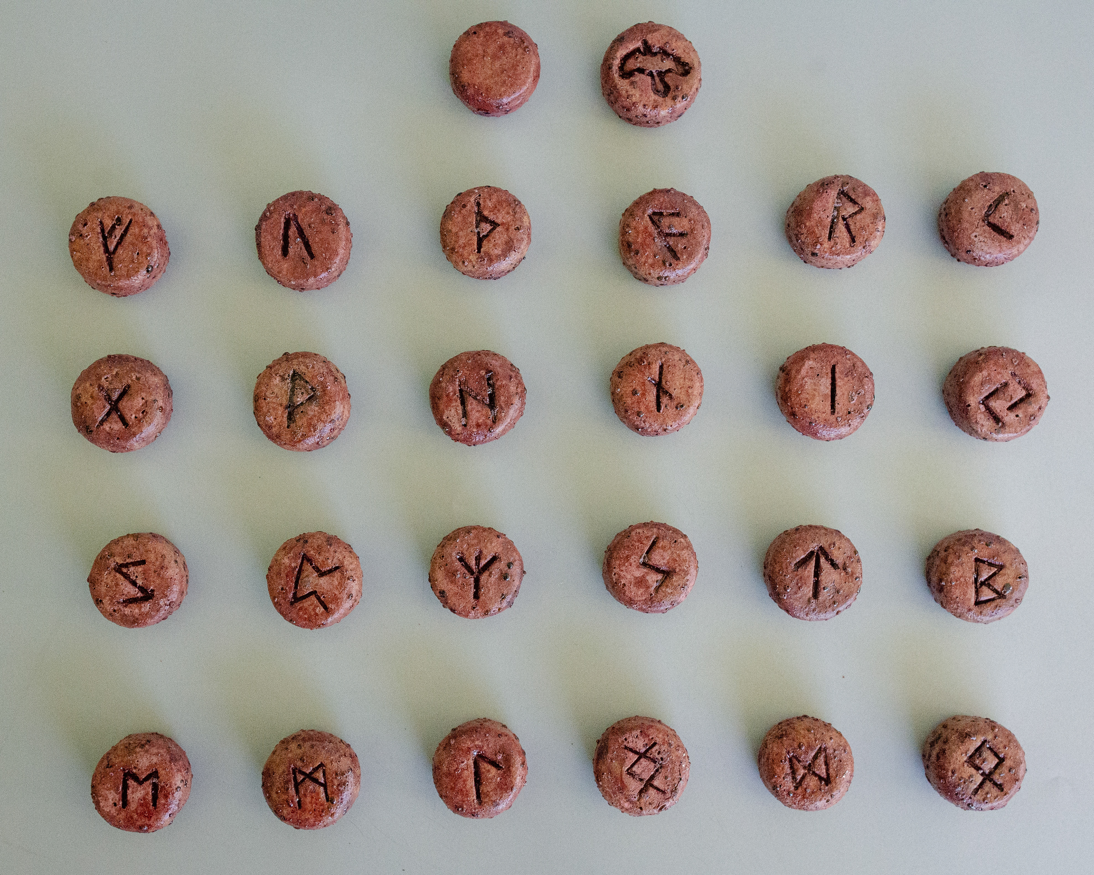 Elder Futhark Rune Stones & Raven stone (2024) Buff Raku Trachyte with Red Iron Oxide & porcelaine paint 2cm (W) x 1cm (H)