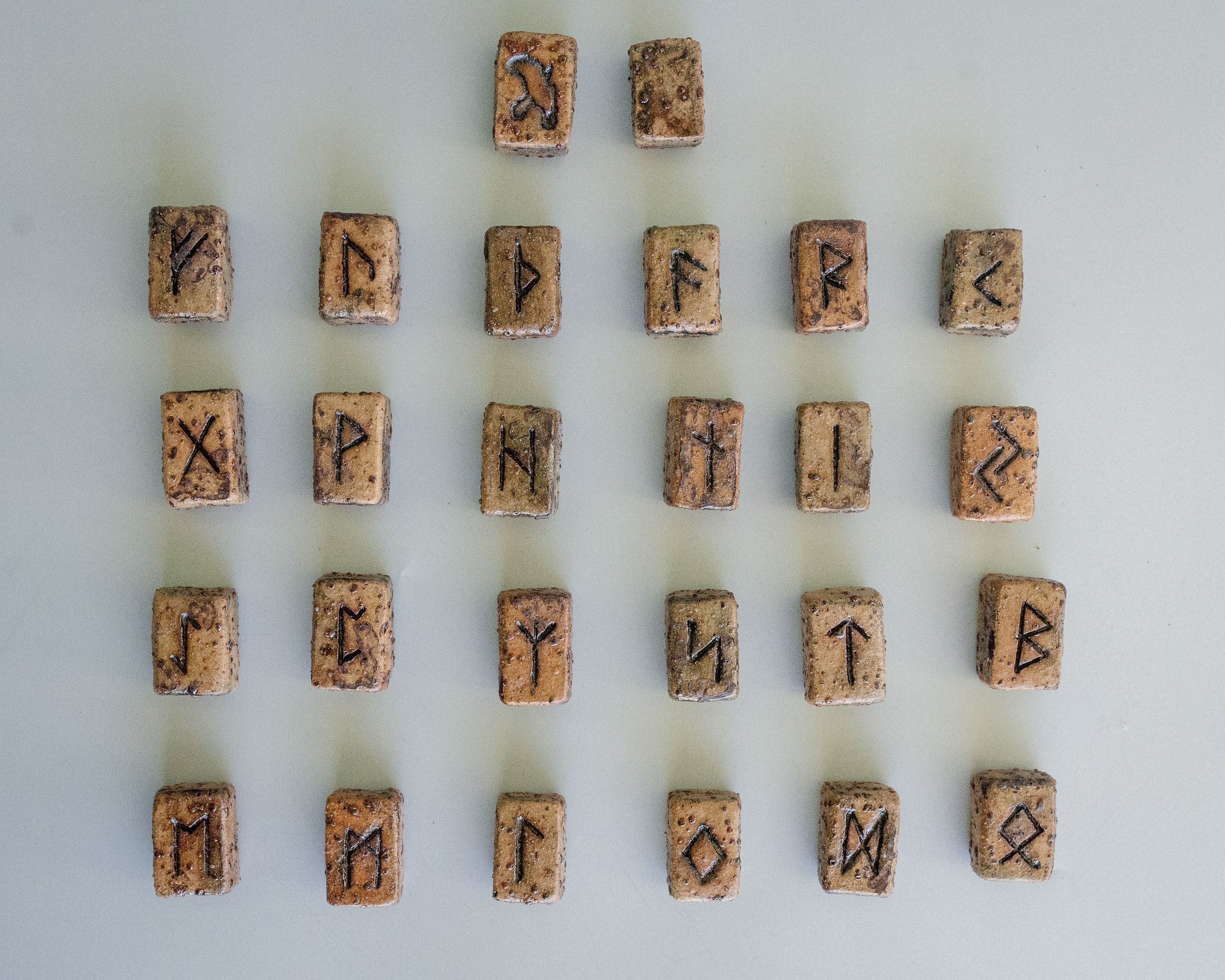 Elder Futhark Rune Stones & Raven stone (2024) Buff Raku Trachyte with Red Iron Oxide & porcelaine paint 2cm (W) x 1cm (H) Elder Futhark Rune Stones & Raven stone (2024) Buff Raku Trachyte with Red Iron Oxide & porcelaine paint 2cm (W) x 1cm (H)Elder Futhark Rune Stones & Raven stone (2024) Buff Raku Trachyte with Red Iron Oxide & porcelaine paint 2cm (W) x 1cm (H)