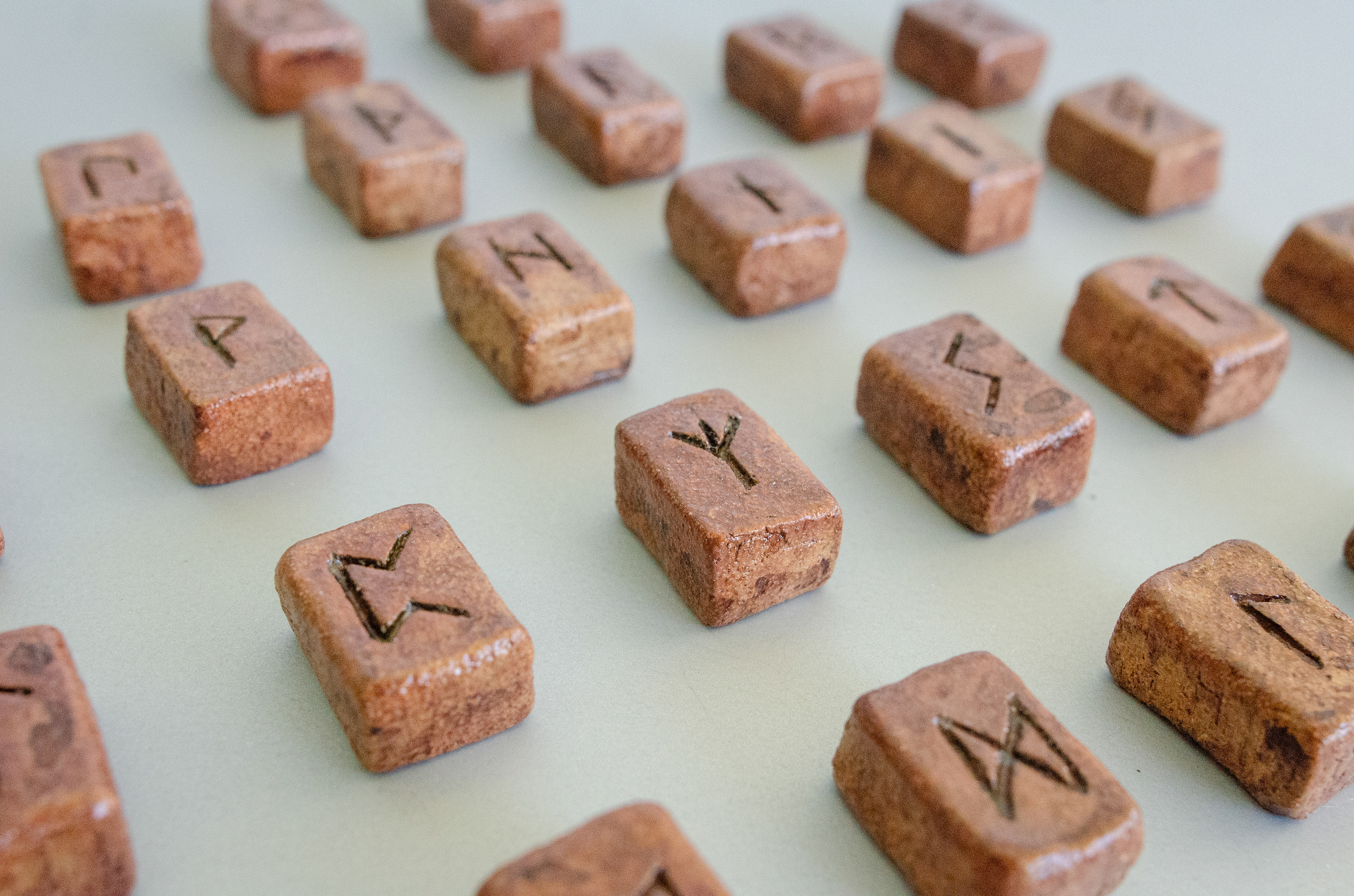 Elder Futhark Rune Stones & Raven stone (2024) Buff Raku Trachyte with Red Iron Oxide & porcelaine paint 2cm (W) x 1cm (H)
