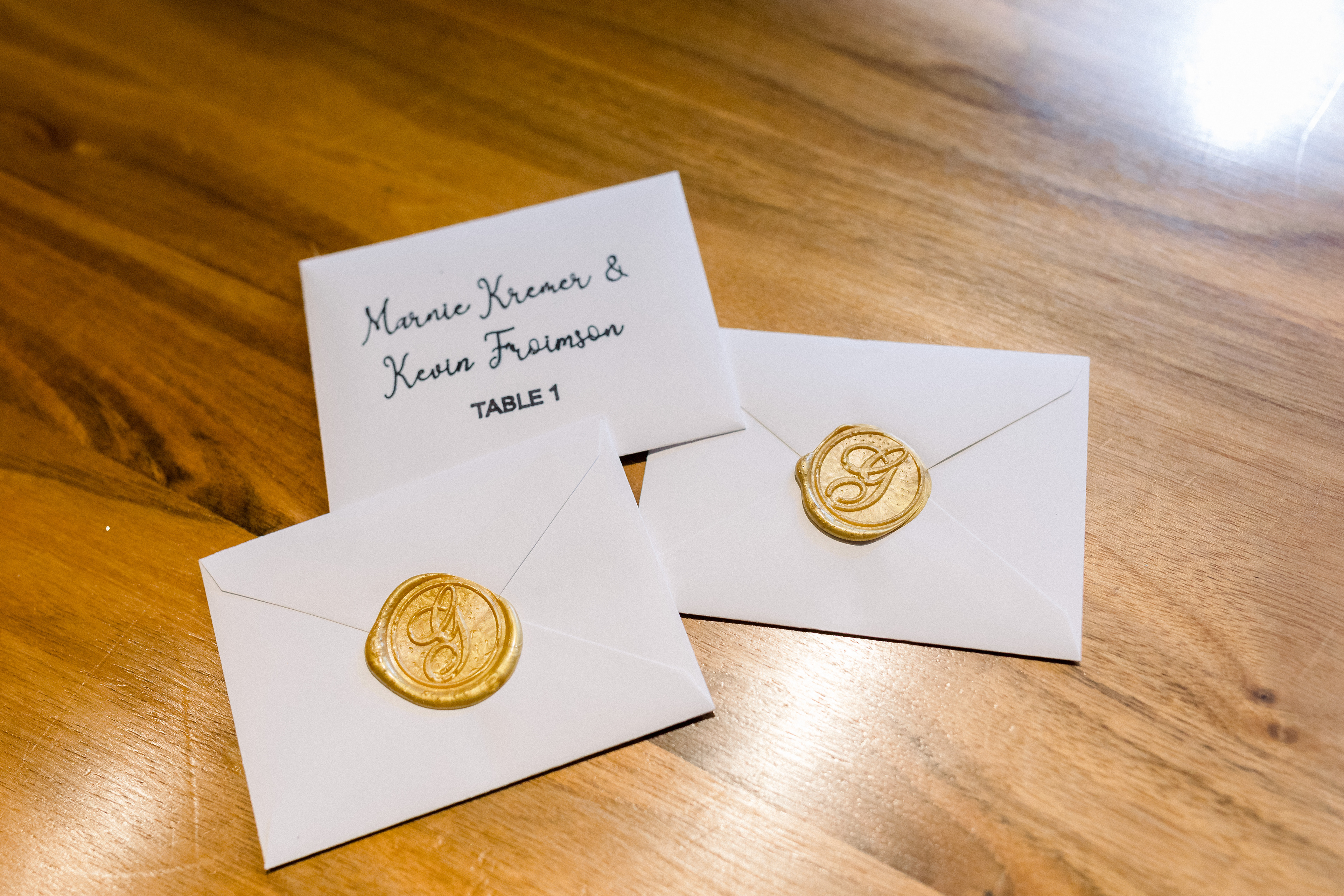 Designed and created 100+ seating cards with hand sealed wax stamps.