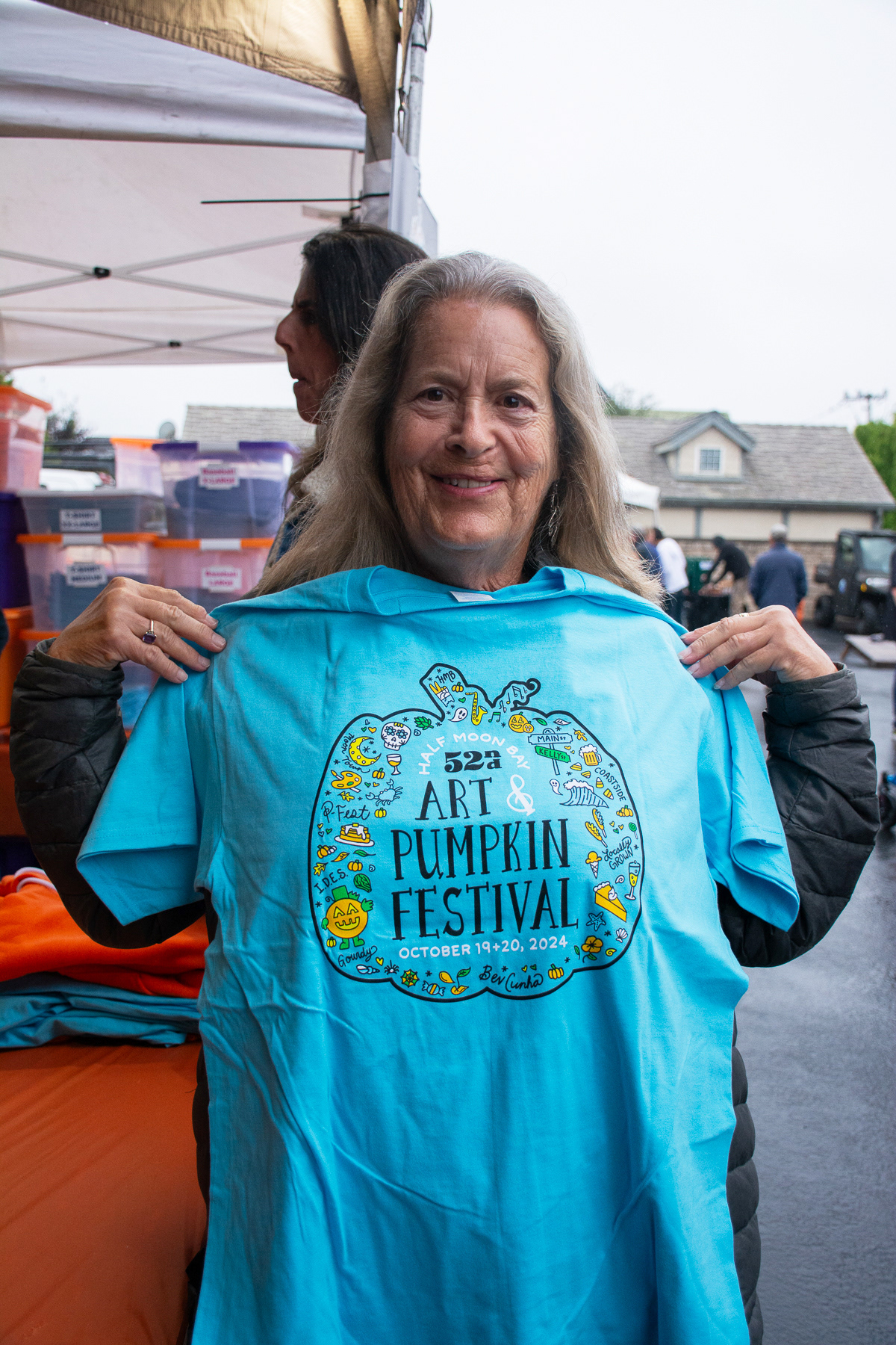 A Weigh-Off attendant takes home a blue PFest shirt.