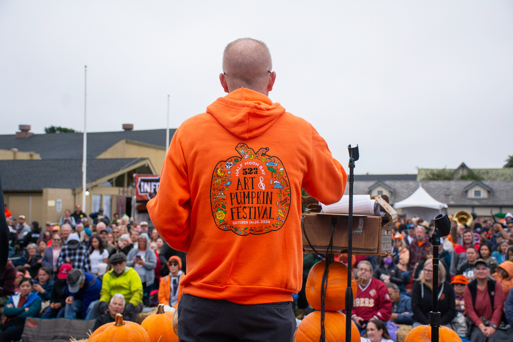 Local business owner Josh Warshauer presenting the Weigh-Off Ring in his Orange Pfest Hoodie.