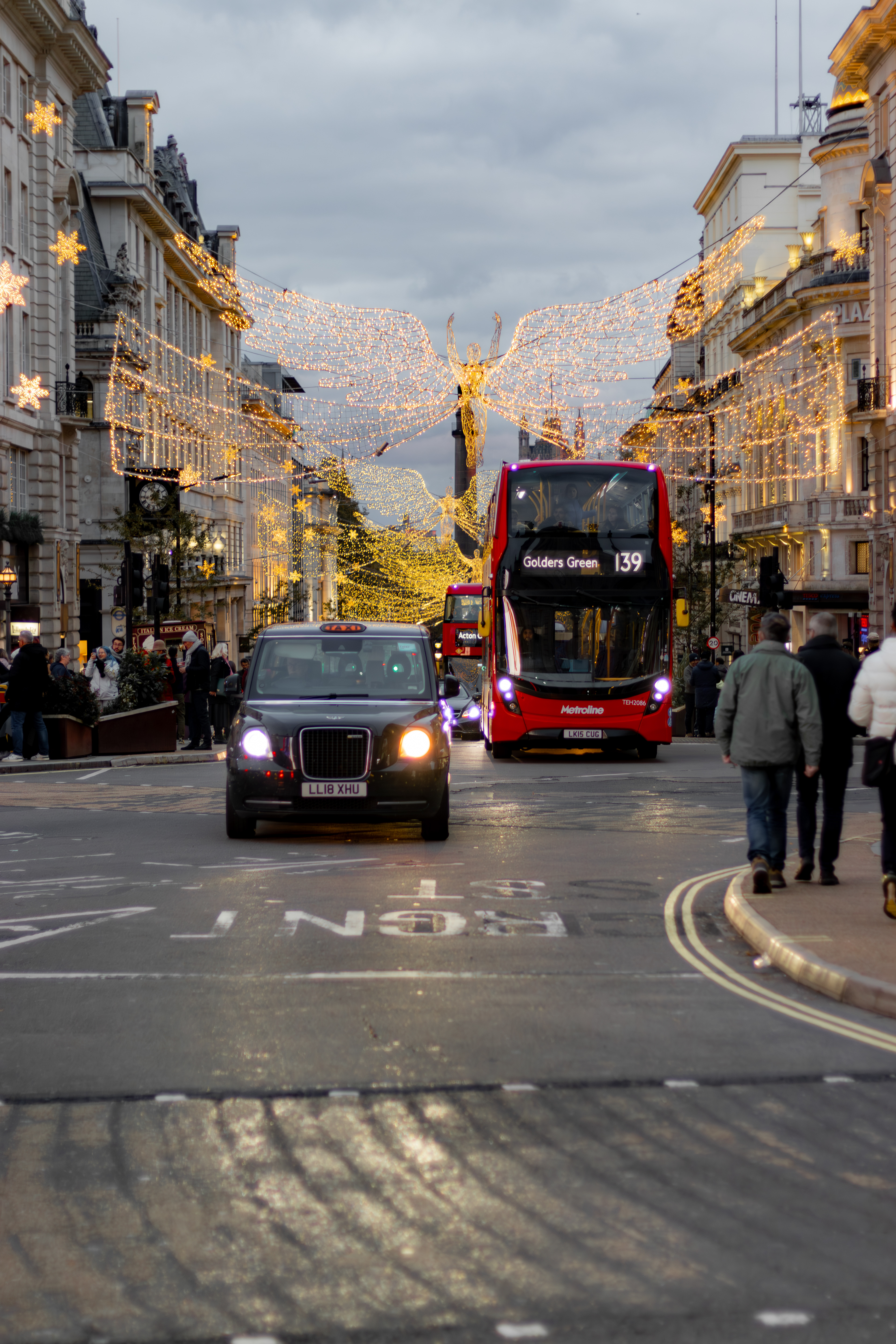 London, black cab and red bus driving side by side