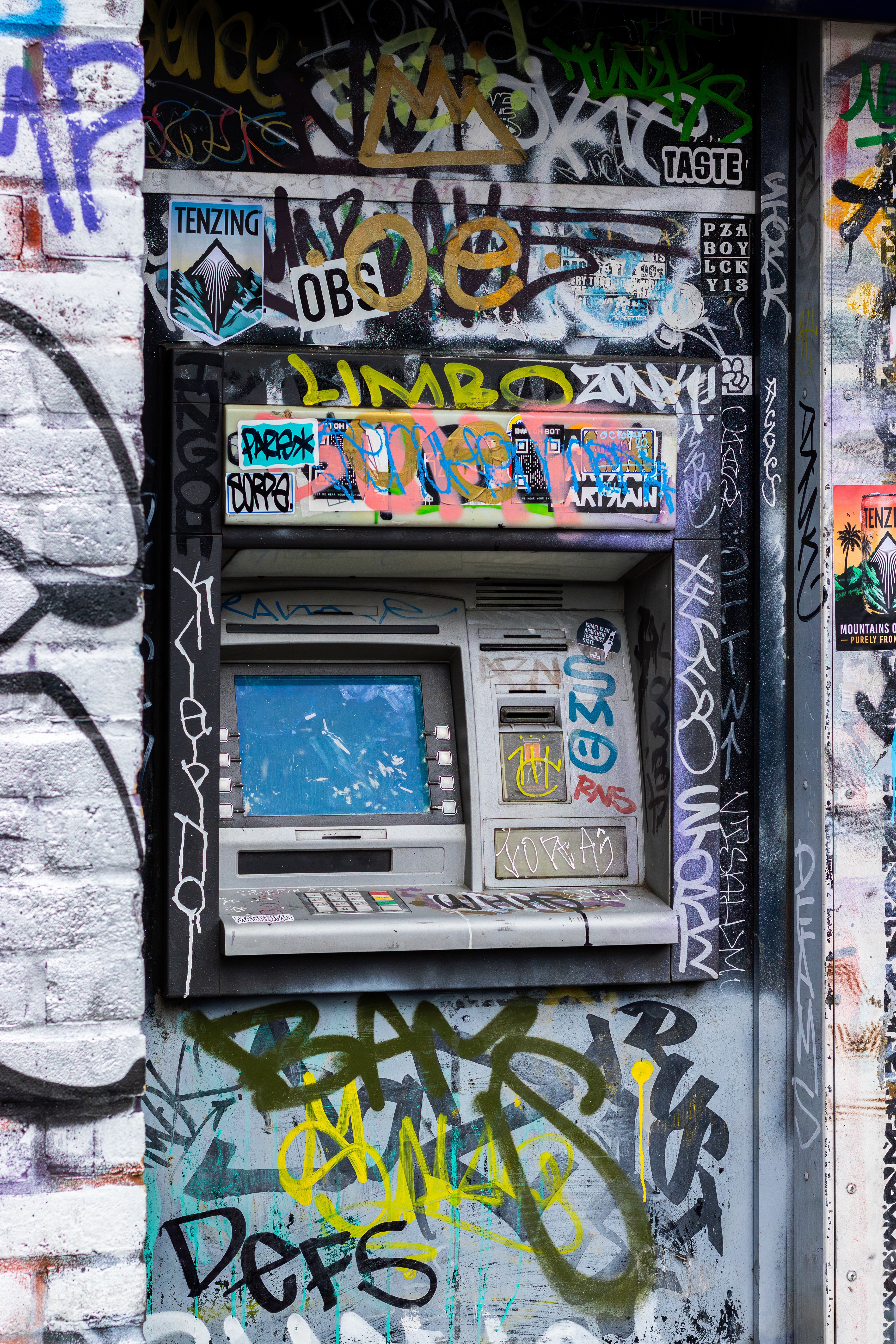 London, graffiti covered ATM