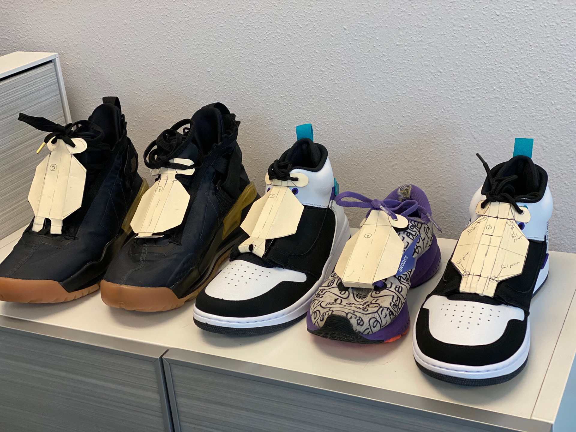 2nd prototypes: Found a solution for attaching shoe armor using laces and explored this with file prototypes for sizing. 