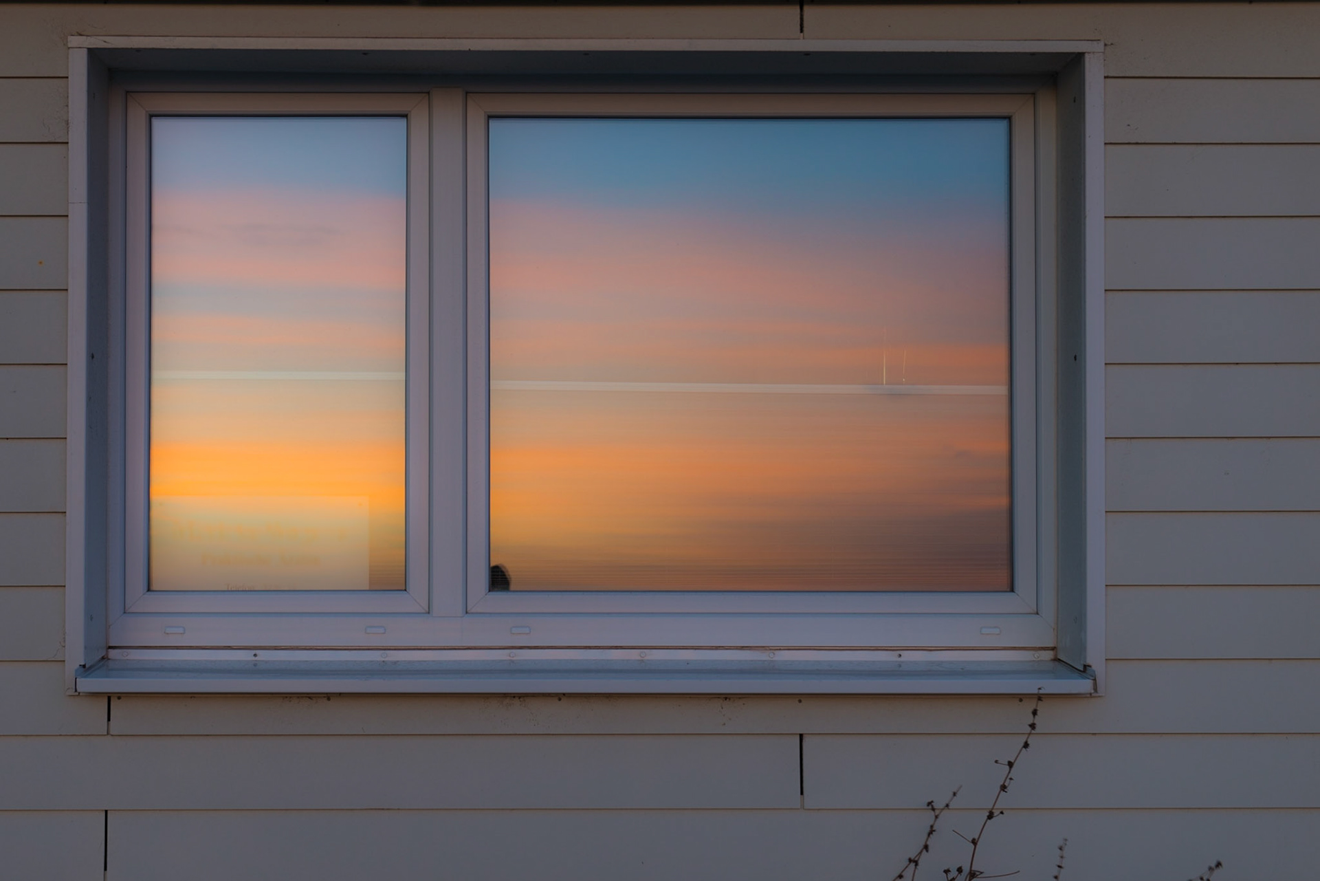 Ein Fenster voll Sonnenaufgang